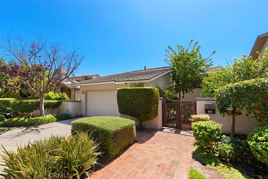 Gated community, beach close, Single loaded street on cul-de-sac.  This beautiful Bi-level is a Chris Abel design over looking a beautiful park setting with no homes directly behind.  There is a peek ocean view and a massive wrap around deck and plush vegetation.  At entry, you have two choices, go up or down.  Approx. 7 steps to living room, formal dining room, spacious wonderful kitchen with center island and new appliances.  Then step up 4 steps to a computer center or den with sliding patio doors to small deck.  Should you selecte to go down stairs, you will find two bedrooms and two baths with sliding patio doors to patio and yard.  The Primary bedroom is super spacious with it's own fireplace and extremely large walk-in closet.   The Primary bath offers walk-in shower, soaking tub and his and hers sinks. The  Second bedroom  has it's own bath with walk-in shower.  There is a two car attached garage with a seperate laundry room.  Owner just put in new gas furnace and central air.  The community does offer a pool and spa.  Custom light birch wood staircase, with matching color flooring throughout!  All white kitchen with large center island, pantry and new appliances and eating area.  This beauty offers tons of light throughout the home.  BBQ grill on deck and beautiful area for relaxing and soaking in the sun.  The ding room is spacious with alot of windows and patio door to deck.  The living room offers lots of drama with wood beams and fireplace along with patio doors to deck.