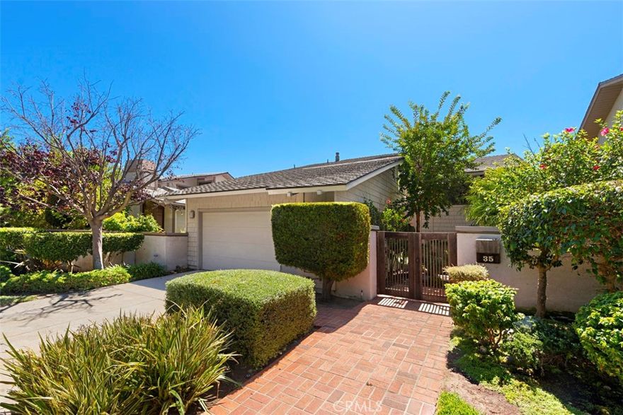 Gated community, beach close, Single loaded street on cul-de-sac.  This beautiful Bi-level is a Chris Abel design over looking a beautiful park setting with no homes directly behind.  There is a peek ocean view and a massive wrap around deck and plush vegetation.  At entry, you have two choices, go up or down.  Approx. 7 steps to living room, formal dining room, spacious wonderful kitchen with center island and new appliances.  Then step up 4 steps to a computer center or den with sliding patio doors to small deck.  Should you selecte to go down stairs, you will find two bedrooms and two baths with sliding patio doors to patio and yard.  The Primary bedroom is super spacious with it's own fireplace and extremely large walk-in closet.   The Primary bath offers walk-in shower, soaking tub and his and hers sinks. The  Second bedroom  has it's own bath with walk-in shower.  There is a two car attached garage with a seperate laundry room.  Owner just put in new gas furnace and central air.  The community does offer a pool and spa.  Custom light birch wood staircase, with matching color flooring throughout!  All white kitchen with large center island, pantry and new appliances and eating area.  This beauty offers tons of light throughout the home.  BBQ grill on deck and beautiful area for relaxing and soaking in the sun.  The ding room is spacious with alot of windows and patio door to deck.  The living room offers lots of drama with wood beams and fireplace along with patio doors to deck.