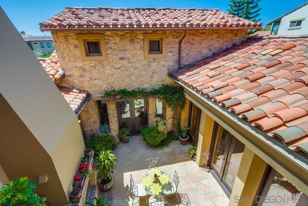 Welcome to elegant living in Avaron Del Sur. This stunning classic home features high quality construction and finishes throughout. Interior highlights include a chef's kitchen, center island with prep sink, stainless steel appliances, granite counters, butlers pantry, walk-in pantry & ample storage cabinetry. Built-in side-by-side refrigerator, double ovens, professional 6-burner gas stove. Light filled living/dining room with fireplace and french doors opening to striking courtyard patio, with fireplace. A first floor master bedroom suite, featuring dual vanities, make-up vanity, large soaking tub and separate shower. A private first floor en-suite for guests. including full bath. Large first levelhome office, with adjacent 1/2 bath. Family room centers around large built-in media cabinet, stone fireplace and surround sound. The Tuscan architecture, with Tumbled Travertine flooring in the Versaille pattern add to the warm and bright feel of this home. Situated on a.26 acre lot the 4 Bed / 1 optional and 4-1/2 Ba. almost 4,000 sq ft. home offers spacious comfort living. Main floor laundry room with deep laundry sink and ample storage. Backyard is perfect for a beautiful private outdoor gathering space, featuing a lush, quiet manicured garden environment. Separate one and two car epoxy fooring garages and full home water purification system and Solar. Avaron residents enjoy access to all 14 community parks in Del Sur—11 of which feature pools—creating an unparalleled lifestyle centered around family, recreation, and community. Nearby Crosby Club with award winning golf course and amenities. Gated community, top ranked schools and shopping