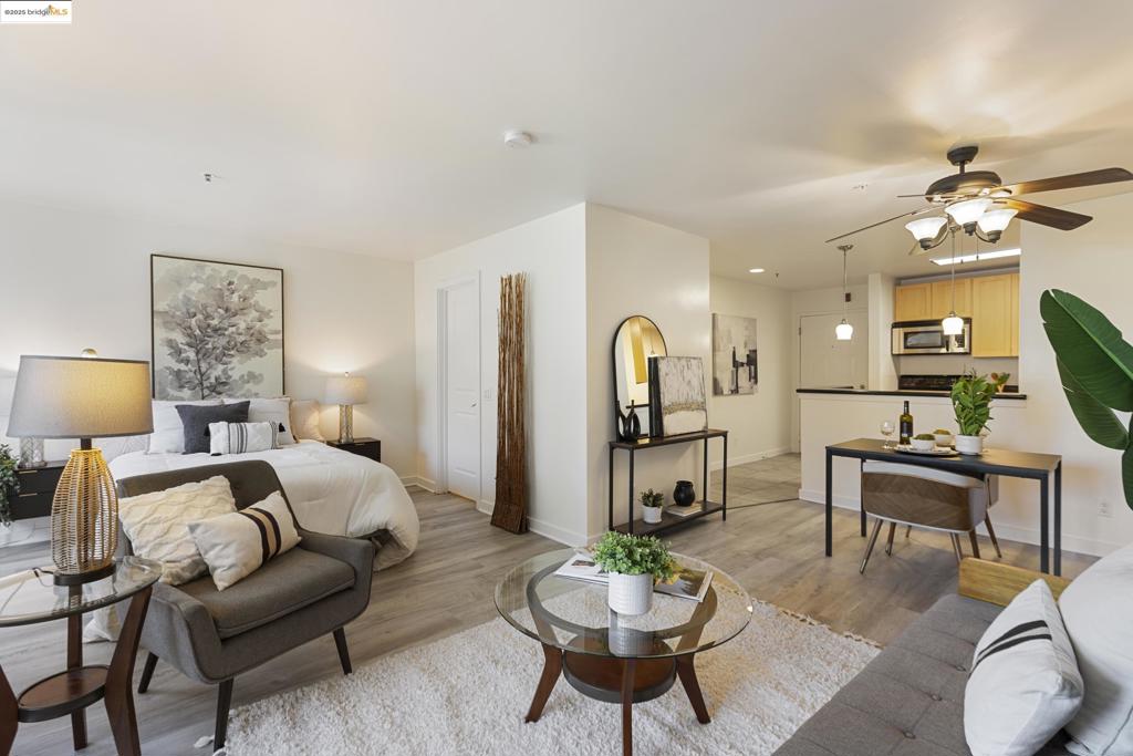 Call today to schedule an appointment for Emeryville's most affordable condo! Welcome to easy living in this spacious, tranquil and comfortable move-in ready home. The open concept floor plan features new flooring, energy efficient windows, and stainless steel appliances. Additional storage is available on the private balcony which overlooks a beautifully landscaped courtyard. This unit can also easily convert to a 1-bedroom. Conveniently located in the well-maintained Bridgewater complex, you’re just steps away from laundry facilities and elevator. The deeded secure parking space is also near the elevator and mail room. A full array of amenities including the Clubhouse, fully equipped gym and spa, business center, pool, hot tub and BBQ areas add further enjoyment and value. Located in the heart of Emeryville, you’re a short walk to the Public Market, Bay Street and Powell St. Plaza. AC Transit local and TransBay service, as well as the free Emery Go Round Shuttle stop just outside the complex for easy commuting; I-80 is also just a few blocks away.