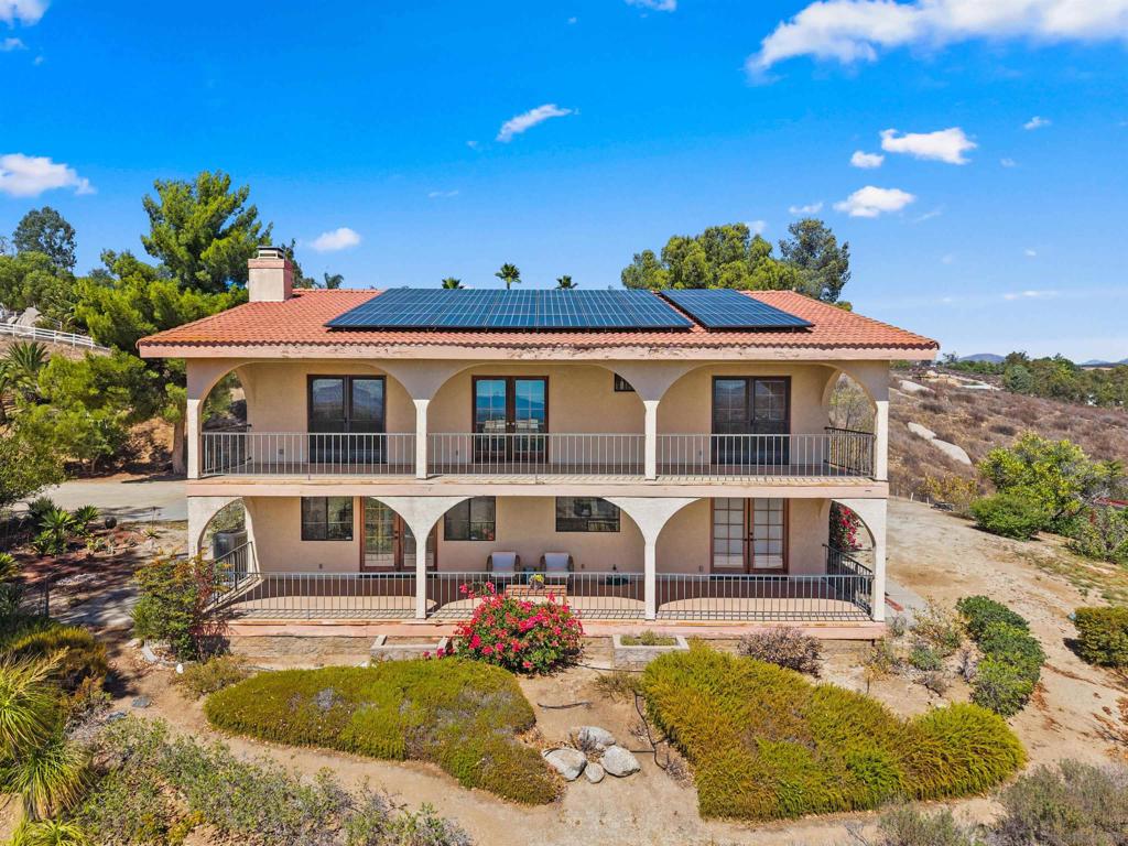Spectacular unobstructed views from every room! Must See In Person! Welcome to Angel Hill - your dream retreat in the heart of Temecula’s wine country. Perfectly positioned on 2.7 acres of gated, southeast-facing land, perfect for growing your own grapes. This home comes with fully owned solar, ample room for parking and is surrounded by numerous varieties of mature fruit trees, rose bushes, rosemary and lavender. Unlimited opportunities available with the onsite barn - complete with full electric and plumbing. Potential for ADU, workshop, yoga studio, retreat space, office ready at your fingertips. This home boasts sweeping Tuscany like views from the kitchen and living room to the bedrooms. With two covered balconies you are sure to enjoy every captivating sunset and sunrise. Additional upgrades a new Lennox HVAC system with UV filtration, upgraded ducts, a newly installed infrared sauna, and recent barn improvements. You won't beat these views! Your wine country lifestyle awaits—don’t miss this incredible opportunity!