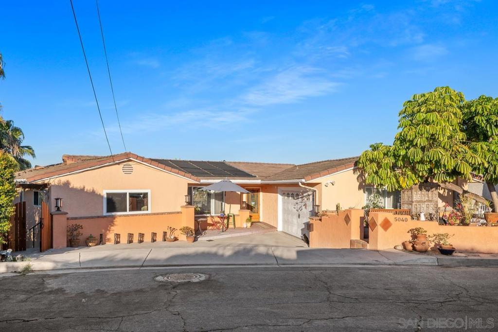 Just steps from the heart of La Mesa Village, tucked away on a peaceful cul-de-sac just a short walk from the heart of Downtown La Mesa, this expansive 5-bedroom, 5-bathroom home offers over 4,000 square feet of beautifully designed living space with panoramic views of Mt. Helix. Perched on a .34 acre lot, this home includes paid solar, a sparkling pool, and multiple indoor-outdoor areas ideal for quiet relaxation or effortless entertaining. See Supplemental... With a flexible floor plan, this home is ideal for multigenerational households, hosting long-term guests, or income-producing opportunities. Real wood slat flooring brings warmth and character, while the updated primary bath adds a touch of modern comfort. From morning coffee on the patio to evening gatherings under the stars, the backyard is a private oasis. Just blocks from MacArthur Park, coffee shops, farmers markets, and dining in La Mesa Village—this is the rare opportunity where lifestyle, space, and location come together - this is one you won’t want to miss!