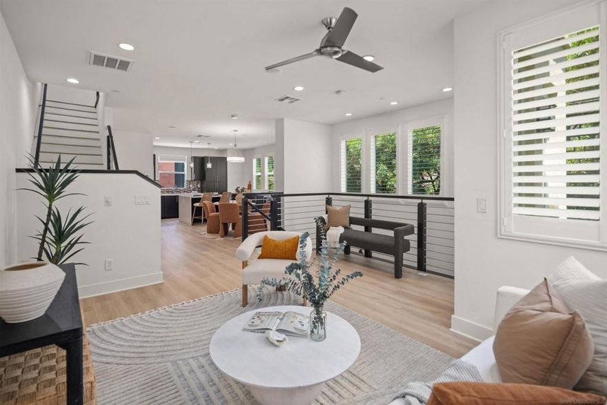 Welcome to one of Origen’s largest and most versatile homes, nestled along a scenic hillside with 2,100 sq. ft. of beautifully designed living space. This four-story residence offers the perfect blend of style, function, and flexibility with three bedrooms and a top-floor loft that can easily serve as a second living area, home office, kids’ playroom, guest space—or anything your lifestyle calls for.  Step inside to discover new luxury vinyl plank flooring that adds warmth and elegance throughout the main living spaces. The entry level features a private guest bedroom with a full bathroom and access to the attached two-car garage. On the second level, the open-concept kitchen, living, and dining area is ideal for entertaining, complete with a double oven, built-in wine fridge, and direct access to a private patio with a natural gas hookup—perfect for grilling and outdoor dining.  Upstairs, the spacious primary suite offers a peaceful retreat with a cozy seating area, spa-inspired bathroom, and a generous walk-in closet. A third bedroom with its own en-suite bath completes the upper floor. Don’t miss your chance to own this thoughtfully designed home in one of Mission Valley’s most desirable and fast-growing communities.  Civita is one of Mission Valley’s most sought-after communities, known for its modern design, walkable layout, and unbeatable central location. Just minutes from the beach, downtown San Diego, and Snapdragon Stadium, Civita offers the perfect blend of city access and relaxed community living—all within a 15-minute drive. This vibrant neighborhood is packed with everyday conveniences and unique local spots. From LA Fitness and a neighborhood vet to casual dining, coffee shops, and boutique retail, everything you need is just steps away. At the heart of it all is Civita Park—a beautiful 14-acre space that features lush gardens, winding trails, basketball courts, amphitheaters, and open lawns for picnics or events. The nearby Civita Recreation Center adds even more with resort-style pools, a state-of-the-art gym, and outdoor gathering spaces perfect for hosting or relaxing. And there’s more to come. The upcoming development along Civita Boulevard—called The Row—will bring even more energy to the community with a vibrant lineup of restaurants, retail, and services. Whether you’re looking for convenience, connection, or simply a modern place to call home, Civita offers a lifestyle that’s hard to match in San Diego.