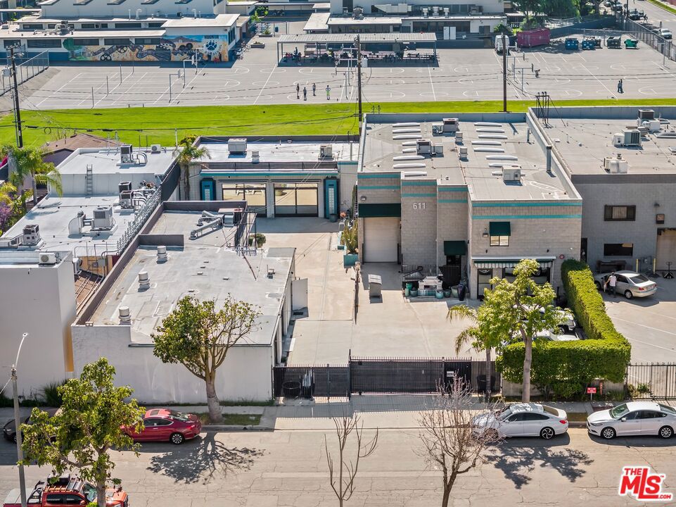 Located just 1.5 miles from Burbank's Media District, 611615 Glenwood Place is a gated 9,952 SF creative compound spread across three distinct structures, offering a compelling mix of showroom, warehouse, and lounge space on 17,549 SF of land. Building One (approx. 4,987 SF) is a two-story structure featuring refined design elements, including Art Deco touches and furnishings sourced from the Queen Mary. Inside, you'll find a full chef's kitchen with Viking appliances, a wood-paneled office, a multi-level lounge, and a formal conference room with a wet bar and custom cabinetry. This space is currently leased at $11,013/month through March 2027. Building Two (approx. 3,052 SF) is a clear-span warehouse with high ceilings and one-way glass roll-up doors, ideal for creative or light industrial uses. The space is currently owner-occupied and would lend itself well to reconfiguration. Building Three (approx. 1,805 SF) sits at the rear of the lot and includes a showroom, wet bar, high-end bathroom, and two large double doors. It is rented to a photographer for $3,000 monthly. Located in a central, high-functioning corridor of Burbank, the property sits just 1.5 miles from the Media District, home to Warner Bros., The Walt Disney Company, and Nickelodeon, an ecosystem of long-standing entertainment anchors that drive real demand year after year. 611 S. Glenwood is also minutes from Downtown Burbank, a bustling hub of retail, dining, and entertainment options, and Magnolia Park, a boutique district known for its walkability, charm, and creative community. Whether you're a collector, creative agency, boutique content firm, or long-term investor, this is a one-of-a-kind asset with utility, privacy, and upside.