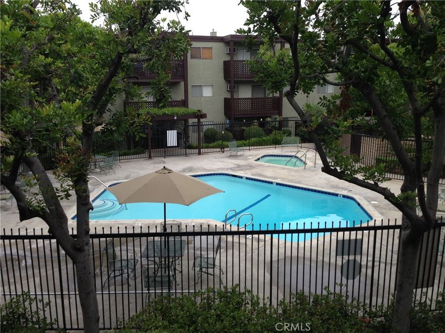 This welcoming two-bedroom, two-bath condo is located in the desirable Arroyo Seco Village community of Highland Park, one of Northeast L.A.’s most vibrant neighborhoods. The home features a comfortable open-concept living and dining area with sliding glass doors that bring in soft natural light and lead to a private balcony. The kitchen offers generous cabinet storage and an efficient layout that flows easily into the living space, while both bedrooms are well-sized with ample closets and neutral finishes. Enjoy the convenience of in-unit washer and dryer hookups, gated parking, and elevator access. The gated complex offers resort-style amenities including a pool, spa, BBQ areas, and mature landscaping that creates a peaceful setting. Perfectly positioned near the shops, cafés, and nightlife of Figueroa Street and York Boulevard, this condo combines neighborhood character, community amenities, and strong transit access. With consistent housing demand, it’s equally appealing as a personal home or an investment opportunity.