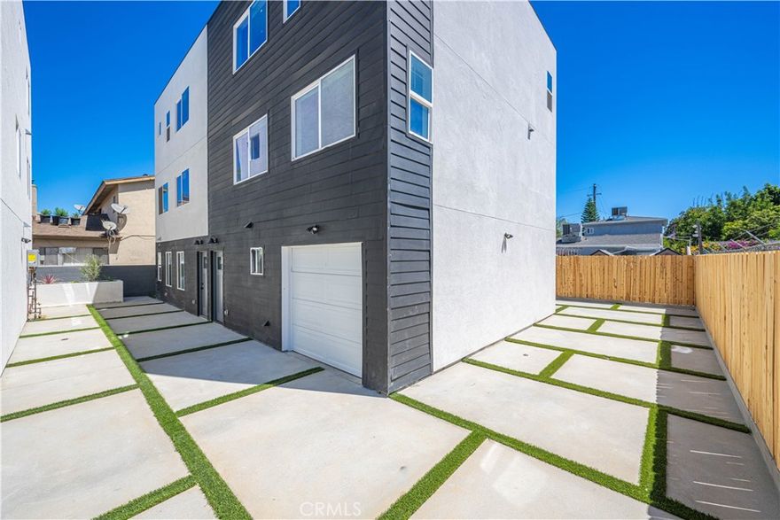 LIKE NO OTHER: Parking is not an issue here: This is the one you've been looking for, newly built  townhouse unit nestled in the heart of the vibrant City of Van Nuys - Step inside this stunning 3-bedroom, 3.5-bathroom townhouse with 1,693 of functional Sq Ft meeting modern elegance with a 1-car attached garage plus an additional 1 car surface parking spot. Located just minutes away from the Valley Glen area and LA Valley Community College, our prime location offers convenience at your doorstep. Enjoy easy access to a range of amenities including Costco, Ralphs, Kaiser, and more. The open floor plan creates a spacious and inviting atmosphere, perfect for both relaxation and entertainment. Prepare culinary delights in the stylish kitchen featuring quartz countertops, designer cabinetry, and an abundance of natural sunlight. Retreat to the master bedroom, complete with a spacious bath and closet, providing a private sanctuary within your home. Laminate wood floors throughout add a touch of sophistication, while the secure environment offers peace of mind. Modern conveniences abound, including a tankless water heater, stainless steel appliances, LED recessed lights, and an in-unit washer/dryer for your utmost convenience. The first floor boasts a second master bedroom with an attached bathroom, offering flexibility and privacy for your guests or family members. Don't miss out on this incredible opportunity, as this townhouse won't be available for long. Secure your future in this exceptional townhome that fits all the current co-living and multi-generational living needs. Call today for a private showing.