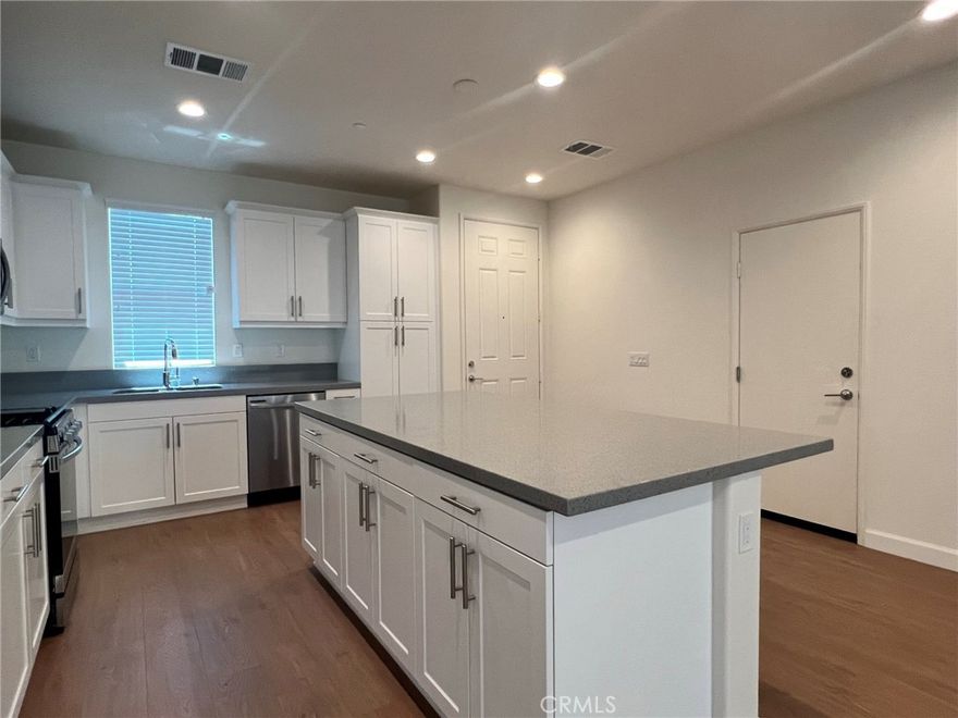4 BEDROOMS WITH ONE DOWNSTAIRS! 3 BATHS 2,144 SF.GATED COMMUNITY WITH COMMUNITY POOL, SPA, CLUBHOUSE,DOG PARK, PLAYGROUND AND PICNIC AREA!OPEN CONCEPT LIVING WITH 9 FT HIGH CEILING DOWNSTAIRS, KITCHEN FEATURES LARGE ISLAND WITH QUARTZ COUNTERTOPS, WHITE THERMAFOIL CABINETRY, STAINLESS STEEL APPLIANCES AND BEAUTIFUL FLOORING. RECESSING LIGHTING, DIRECT ACCESS TO YOUR 2 CAR GARAGE! YOUR PRIMARY FEATURES SPACIOUS WALK-IN CLOSET, FIBERGLASS TILE SHOWER WITH SEAT, DUAL SINKS WITH CHROME FAUCET AND FIXTURE. TANKLESS WATER HEATER, LED LIGHTS THROUGHOUT. YOU WILL NOT BE DISAPPOINTED!