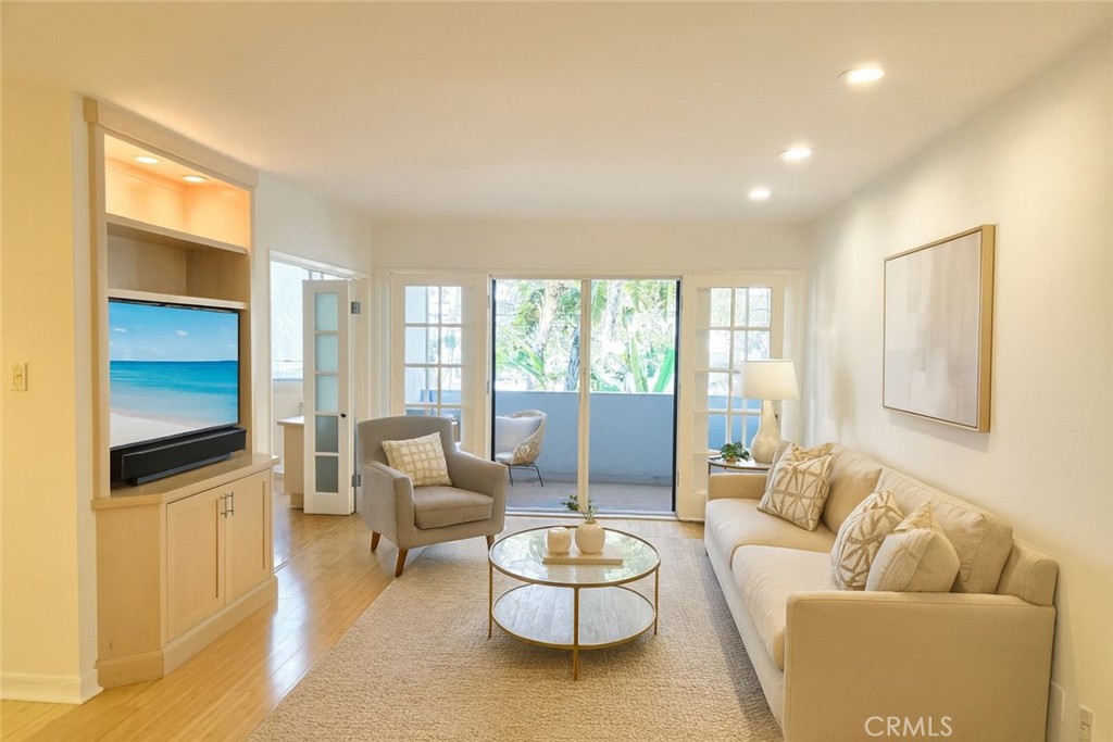 Rare 3 bedroom 2 bath condo in one of the most sought after locations near Montana Avenue. Contemporary hardwood floors throughout. New carpet in the primary bedroom (July 2025). Newly painted in a soft, modern white with dimmable LED lighting. Open floor plan, kitchen overlooks dining area and large living area. French doors open from the living room to an ample balcony. North facing with lots of natural light. Kitchen features granite counters, built-in wine fridge, breakfast bar, electric range/oven, microwave, refrigerator, garbage disposal, and dishwasher. Condo also includes in-unit laundry. Expansive, primary bedroom includes a walk-in closet, en-suite bathroom with dual sinks and large soaking tub/ rain shower. This unit includes lots of built-in storage throughout. Third bedroom is currently set up as an office, with built in desk and storage. Gated garage parking with space for bikes or storage. Awesome building has a grand lobby, intercom entry system, gym, large hot tub, and sauna. Close to the heart of Montana Avenue, near restaurants, excellent schools (Roosevelt, Lincoln), and shopping. Water, trash, gardener included.