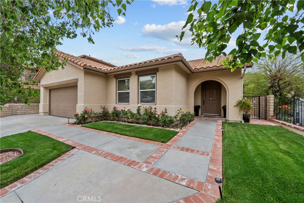 Available for lease at $5000 a month or for purchase at $949,000. Welcome to 28332 Falcon Crest Dr. the Canyon Crest home you’ve been waiting for! This exquisite 4-bedroom, 3-bathroom residence offers 3,066 square feet of beautifully designed living space in one of Canyon Country’s most desirable communities. Built in 2003, the home blends spacious comfort with timeless upgrades. Step into the chef’s dream kitchen featuring granite countertops, cherry wood cabinetry, a walk-in pantry, and top-of-the-line stainless steel Viking appliances. The open layout flows effortlessly into an expansive living area with elegant travertine flooring. Ideal for multigenerational living, the main floor includes two bedrooms one being the generous primary suite with a spa tub, walk-in shower, and great sized closet. A second full bath, laundry room, and a versatile flex space perfect for an office, gym, game room, or as a fifth bedroom complete the downstairs. Upstairs, you’ll find two more bedrooms and a full bathroom, providing the perfect layout for privacy and functionality. Step outside to your private backyard retreat, featuring a waterproof patio, pergola, BBQ area perfect for entertaining or relaxing under the stars. A full water filtration system that services the entire home. Additional highlights include central air & heat (one system that services downstairs and another system that services downstairs), attached 2-car garage, and low HOA of just $85/month. Close to shopping, dining, parks, and top-rated schools. Don’t miss your chance to own this rare gem in the coveted Canyon Crest neighborhood! This is 28332 Falcon Crest Dr.