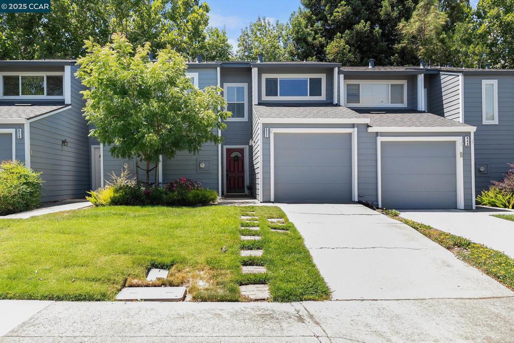 Updated townhome in the sought after Walnut Forest community, This light-filled 2 bedroom, 2.5 bath home features an upgraded kitchen with sleek stone countertops, stainless steel appliances, white cabinetry, and a breakfast bar that opens to the dining area. The freshly painted interior, recessed lighting, and dual sliding glass doors create a bright, open living space anchored by a cozy fireplace. Upstairs, the spacious bedrooms include ample closet space and updated finishes. Step outside to your private patio backed by a serene greenbelt setting. Enjoy access to a community pool, clubhouse, and private Iron Horse Trail gate. Just a short stroll to top rated schools, 680, The Livery shopping center, with cafes, parks, and shops.
