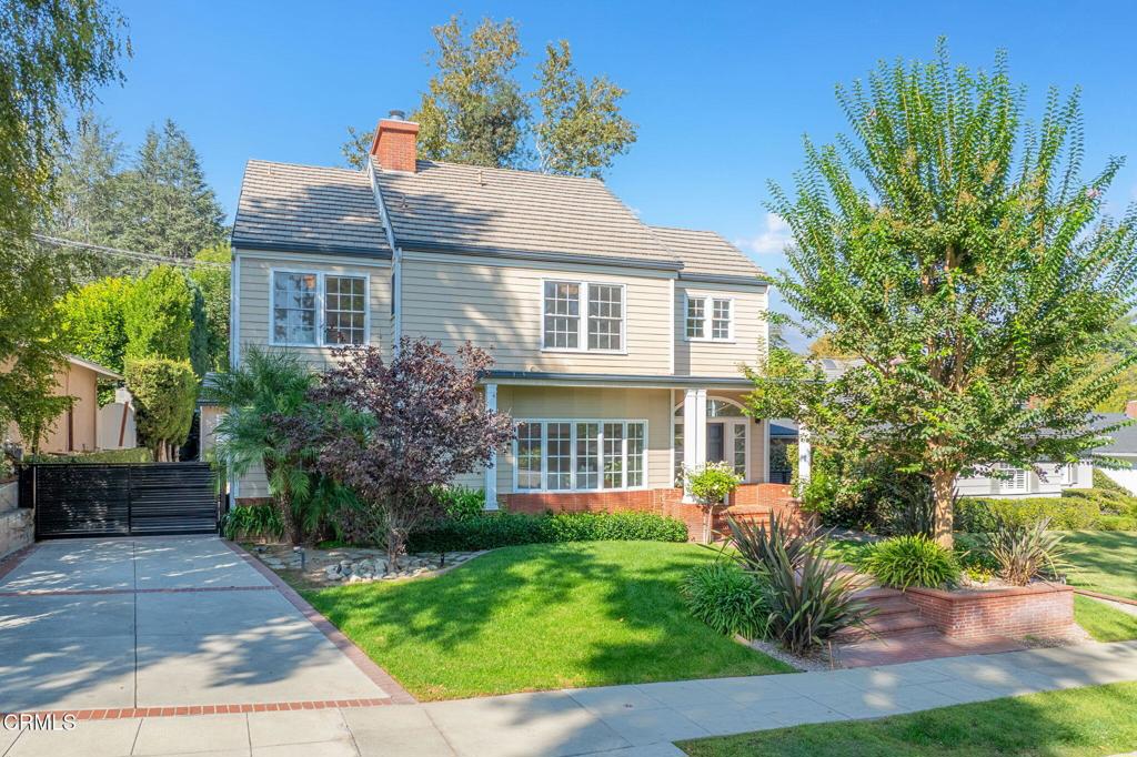 Classically beautiful, extensively updated, and set on the end of a peaceful cul-de-sac, 1345 Lomay Place is easy to fall in love with. This picture-perfect Colonial Revival rests in Pasadena's prestigious Linda Vista neighborhood where lush natural beauty and iconic character homes abound. Exceptional curb appeal leads to elegant interiors showcasing white oak hardwood floors, spacious entertaining rooms, and a graceful layout that connects the main living areas, bringing everyone closer together. As you enter, the formal living room flows into the cheerful family room, with a dual-sided fireplace set between. Radiant picture windows fill the entire area with warm, natural light. The nearby dining room, with French doors to the backyard, welcomes traditional Sunday evening dinners and ambitious holiday feasts alike. Generously sized and well-appointed, the kitchen offers plenty of room for multiple sets of hands to help bring secret recipes to life. A first floor bedroom is easily used as an office while 3 additional bedrooms are found upstairs, including the luxurious primary suite with its soaring cathedral ceiling, gleaming marble fireplace, and dual walk-in closets. A decadent ensuite and a massive private balcony with mountain views enhance this treasured sanctuary. Two additional bright and cheerful bedrooms share a convenient Jack-and-Jill bathroom. Summer bliss awaits out back where you'll enjoy ice-cold drinks on the shaded patio while flipping patties on the built-in-grill, gleeful shouts of 'Marco' and 'Polo' ringing out from the baja pool all the while. Finally, the gated driveway includes a Tesla charger while offering plenty of space for parked cars or training-wheel bike rides. In a treasured neighborhood known for its natural beauty, architectural charm, and strong sense of community, 1345 Lomay Place is a home where life feels both peaceful and complete.