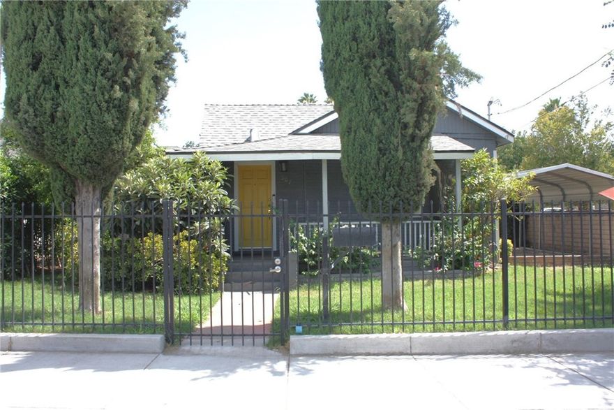 Adorable Craftsman Bungalow, 2 bedrooms 1 bath, living room and entry room. Wood flooring throughout with tile in kitchen and bathroom.  Modernized updated kitchen with white cabinets and granite counters.  Central heat and air.  Entire home is electric.  Property is fully fenced.  Fenced front yard and back yard.  Driveway has an automated gate that leads to covered parking.  Property is zoned commercial so a business can rent as well.  Located downtown Redlands with eateries, restaurants, bars, shopping and 10 freeway very close.  Comes with refrigerator and washing machine.  Tenant will be required to maintain the lawn.