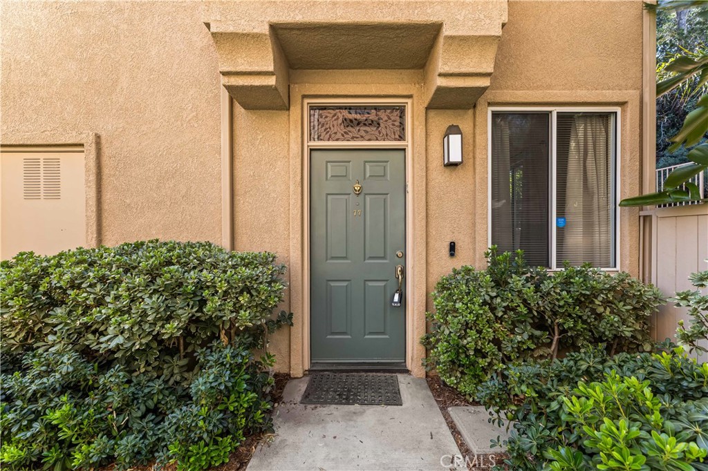 Beautiful end-unit townhome in the Rose Arbor Community. Laminate wood flooring throughout the home. This cozy home features Ceasarstone quartz countertops and stainless steel appliances. Come into this beautiful open floor plan with a fireplace and a separate dining area that lets in plenty of natural light throughout the day. The fabulous master suite and master bathroom have tile floors with dual vanity. All bedrooms are on the second floor of the home. Attached garage to the unit; a second garage in just around the corner. Welcoming low-maintenance landscaping backyard for guests to enjoy. No Mello-Roos, Low HOA fees and homeowners insurance are covered by the HOA. This corner gem is an absolute must-see.