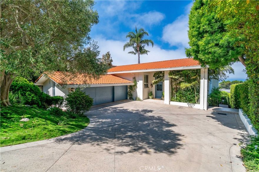Experience the best in Palos Verdes luxury real estate with this beautifully updated ocean view home designed for comfort, style, and sophistication. Situated in Lunada Bay of Palos Verdes Estates, one of the most desirable neighborhoods, this residence offers expansive views, a thoughtful floor plan, and elegant upgrades throughout.  The top floor boasts soaring high ceilings and oversized windows framing the breathtaking views. The gourmet custom kitchen features a center island, premium marble countertops, and fresh white cabinetry, seamlessly connecting to the formal dining room. The recent upgrades consist of high quality materials and fabrication, built to last.  Also on the top level are a well-appointed three-quarter bath, a guest bedroom, plus the luxurious primary suite—complete with a spa-like bathroom, walk-in closet, and direct access to a private balcony and ocean view deck.  The lower level offers a spacious family room, a bedroom converted into a play area (easily reverted to a fifth bedroom), two good sized bedrooms, and a stylish full bath. All rooms are generously sized, providing flexible living options for family and guests.  Step outside to a beautifully landscaped backyard with a built-in gas firepit, lush grass area, and mature fruit trees; orange, kumquat, plum, peach, lemon and lime. The sloped driveway leads to a private three-car garage, ensuring both privacy and convenience.  1232 Via Coronel is perfect for those seeking a luxury home in Palos Verdes with ocean views; this property combines coastal elegance, modern upgrades, and a prime location close to schools, shopping, and scenic trails.