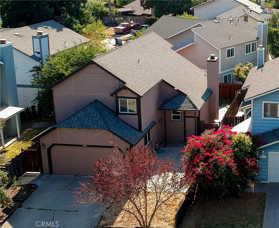 Charming Two-Story Home in Desirable Turlock Neighborhood! Featuring 3 spacious bedrooms, 2.5 bathrooms, and wood flooring throughout. Step inside to a bright living room with cathedral ceilings, a ceiling fan, and a cozy gas log fireplace—perfect for relaxing evenings. The open-concept design flows seamlessly into the kitchen, which boasts tile countertops, plenty of cabinet space, a breakfast nook, and essential appliances including a dishwasher, gas range, and oven. A convenient powder room is located on the main floor for guests. Upstairs, all bedrooms feature wood floors, ceiling fans, and sliding-door closets. The generously sized primary suite offers private balcony access. The ensuite bath features dual tiled sinks and ample counter space. Located just minutes from CSU Stanislaus, shopping centers, top-rated schools, and easy freeway access, this home combines comfort, style, and convenience. Don’t miss your chance to own this well-appointed home in one of Turlock’s most convenient and desirable areas. Schedule your private tour today!