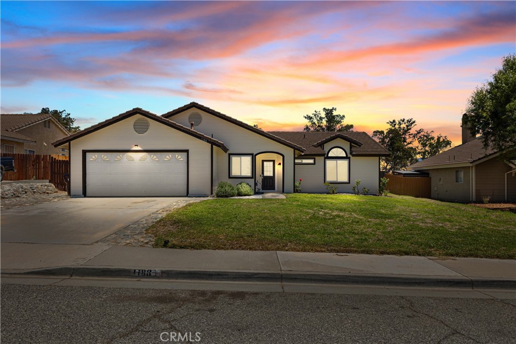 Fresh, Modern, and Move-In Ready!
Step into this beautifully refreshed single-story three bedroom, two full bathroom home where comfort meets functionality. From the moment you enter, you'll be greeted by clean lines, fresh interior and exterior paint, and a sense of bright, open living.
Cozy up by the charming fireplace in the spacious living area, featuring durable large-format tile flooring that flows seamlessly throughout the main living spaces. Plush new carpet in all bedrooms adds a soft touch underfoot, while updated windows and a new slider door invite in natural light and offer improved energy efficiency.
The new hot water tank and utility sink add modern practicality, and the rare drive-through garage opens to a covered vehicle space and concrete pad—perfect for extra parking, projects, or recreation.
Situated on a sprawling, fully fenced lot, this property offers endless potential—whether you're dreaming of a garden, a pool, or a peaceful outdoor retreat. This home is truly a blank canvas to create your own private oasis.
Don’t miss the opportunity to make this clean, comfortable, and updated home your own!