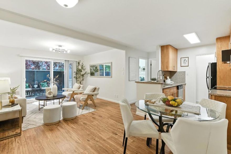 This thoughtfully updated 1-bedroom, 1-bath condo at Peninsula Place in San Bruno combines functionality, comfort, and unbeatable interior location. With a flowing open-concept layout that connects the kitchen, dining area, and living room, the space feels bright and inviting. A private balcony extends from the living area, and the kitchen conveniently includes a refrigerator, electric range, dishwasher, and a step-in pantry. Wood laminate and tile floors run throughout, and the bedroom offers a large closet.  The home comes with one assigned carport parking space. As a resident, youll enjoy resort-style amenities including private access to multiple swimming pools, hot tub, tennis courts, a fully-equipped fitness center, and a clubhouse. Just minutes from BART, Caltrain, SFO airport, shopping centers, and major highways, this condo is ideal for commuters and frequent travelers alike. A comfortable and convenient lifestyle awaits you in the center of it all!