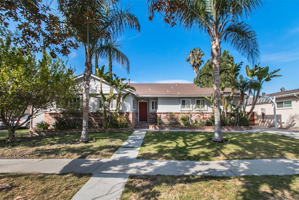 Situated on one of the largest lots in the neighborhood, this remodeled residence offers the perfect blend of style, comfort, and functionality. The home features 5 bedrooms, 2.5 bathrooms, a spacious family room with a fireplace, a heated pool, and a stunning detached guest house. The custom modern kitchen is a true showpiece with sleek cabinetry, stainless steel appliances, white Caesarstone countertops, glass tile backsplash, and a large center island with seating for six. French oak hardwood floors flow throughout, complemented by high ceilings, recessed lighting, and an abundance of natural light. The master suite is a private retreat with a spa-inspired bathroom boasting a tub, separate shower, and travertine finishes. Additional highlights include a newer water heater, an alarm system wired for cameras, a smooth stucco exterior, and beautifully landscaped grounds with irrigation. The backyard is designed for entertaining, showcasing a reconstructed pool with an in-ground pool, a spacious covered patio with ceiling fans and composite flooring, plus a play area with artificial turf. Located with distance to Ventura Blvd., shopping, dining, and temples, this home is a rare find in a highly desirable neighborhood.