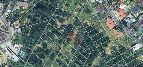 Photo of 3672 E Loosmore St, Los Angeles, CA 90065 (MLS # DW26020957)