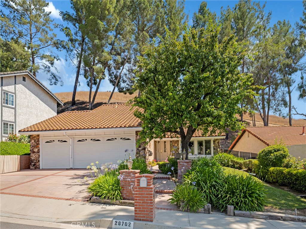 Welcome to this beautifully maintained 5-bedroom, 2.5-bathroom home nestled in the highly desirable Fountainwood neighborhood of Agoura Hills. Offering 2,347 square feet of thoughtfully designed living space, this home features a flexible layout ideal for both everyday living and entertaining.
Step inside to find dual-pane windows throughout, a formal living room with abundant natural light, and an elegant dining area perfect for hosting. The updated kitchen boasts granite countertops, a walk-in pantry, and seamlessly connects to the cozy den—creating a warm and functional hub for gatherings. A downstairs bedroom offers a versatile space for a home office or guest quarters, conveniently located near the half bath.
Upstairs, you’ll find four additional bedrooms, including a spacious primary suite featuring a private balcony, walk-in closet, and en-suite bath.
Enjoy the outdoors in your private, low-maintenance backyard, complete with two expansive side yards ideal for a dog run, garden, or extra storage. A wide driveway and oversized 3-car garage provide ample room for vehicles, storage, and hobbies. Situated in the award-winning Las Virgenes Unified School District and just minutes from scenic hiking trails, beautiful parks, local dining, and the 101 freeway, this home offers the perfect blend of space, style, and location. Don’t miss the chance to make this Fountainwood gem your new home!
