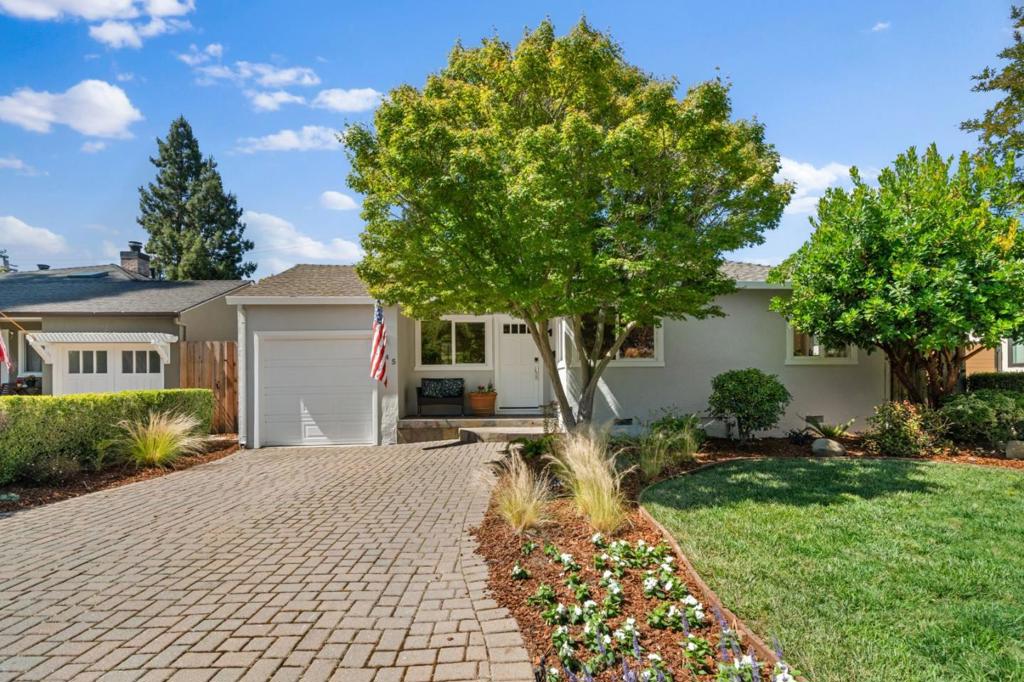 Ideally located just two blocks from Castro Street and a short stroll to the Caltrain station, the award-winning Sunday farmers market, and Mercy-Bush Park, 545 Fairmont Avenue offers a rare opportunity to enjoy both serenity and vibrant city living. Nestled on a quiet, tree-lined street in centrally located Mountain View, known for its thriving downtown and Silicon Valley roots, this home sits in one of the city's most desirable and well-established neighborhoods. Sunlight pours into the thoughtfully designed interior, where hardwood floors, crisp crown molding, and expansive windows create an atmosphere of warmth and ease. The bright, updated kitchen features white cabinetry, classic tile finishes, and picturesque garden views. Three well-proportioned bedrooms and two full baths complete the intuitive single-level layout. Step outside to a private, peaceful backyard retreat framed by mature trees and privacy hedging. A full-width covered deck offers the perfect setting for hosting guests, dining al fresco, or simply unwinding at the end of the day. With close proximity to parks, top tech campuses, and all the best of downtown, this move-in-ready home offers the rare combination of location, lifestyle, and the very best of California living.