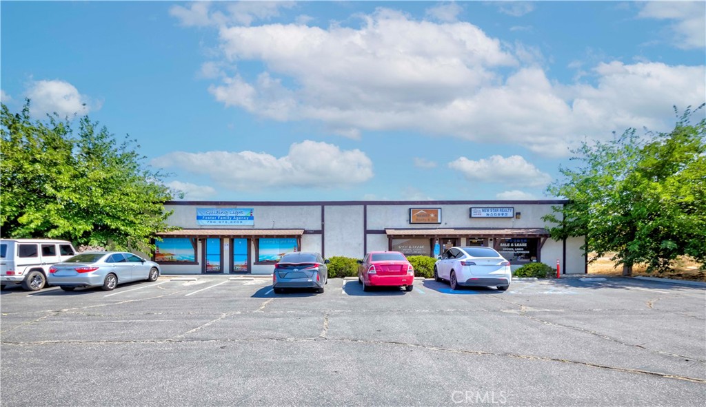 Situated in the heart of Victorville’s most dynamic district, this prime commercial property, built in 1980, comprises four spacious units. A and B units are occupied and C and D units are vacant. The property sits on approximately half an acre along a major road, offering ample parking in the rear and ease of access to the 15 freeway enhances the property's appeal, providing seamless connectivity to major transportation routes. Don't miss your chance to capitalize on this prime location in Victorville.