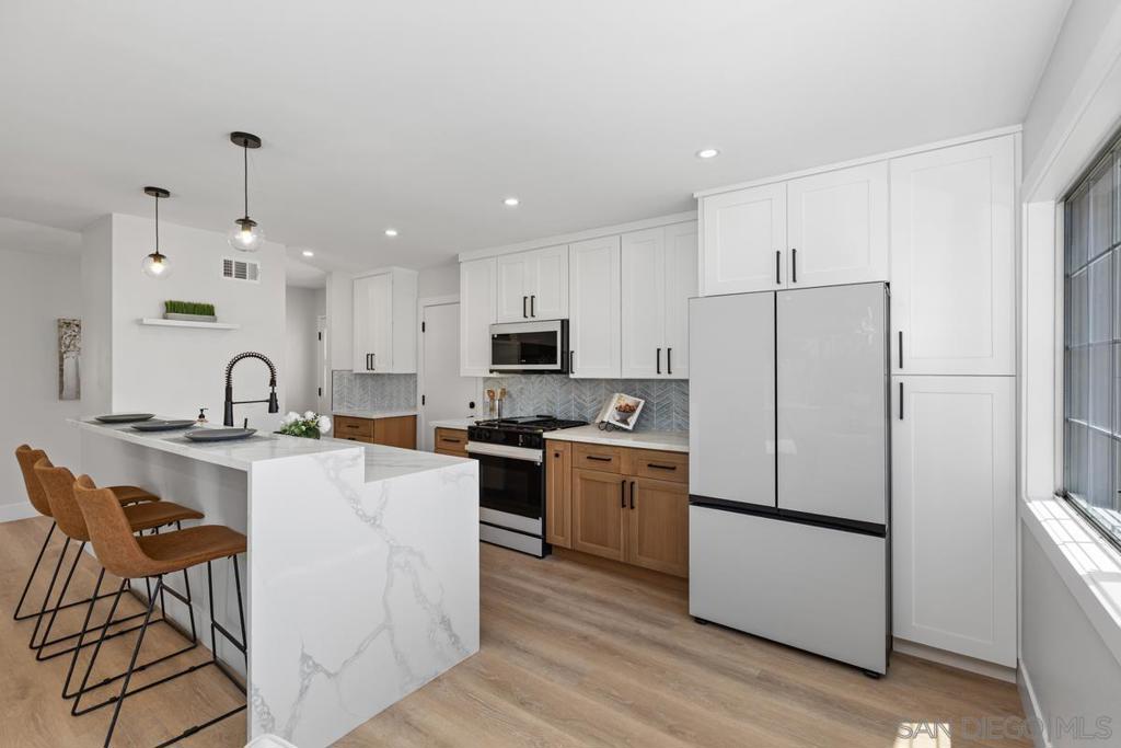 Priced to sell! Beautifully remodeled, single level home on a coveted Mount Street; this one has it all! Step into the open floor plan interior that allows highly functional living; with remodeled kitchen with lots of cabinets and counter space, quartz tops, custom backsplash and new Smart appliances, and 42" bar height counter for eat up dining, is perfect for entertaining. Living area also features a custom tiled fireplace ready for TV, LVP flooring throughout. Nicely appointed remodeled bathrooms with custom tile and white oak vanities. Enjoy San Diego living on the outside of this home featuring large front and rear yards, well manicured, low maintenance landscaping with LOTS of synthetic turf, and large patio for family gatherings. Some other recent upgrades include: new ABS plumbing, quality plumbing and electrical finishes, new doors, baseboards, casing, painting inside and out, new FAU & Mini split AC Condenser, and so much more! The home is located in a central neighborhood in San Diego with easy access to freeways, beaches, parks, hiking, dining, and entertainment, making it perfect for those who enjoy an active lifestyle.