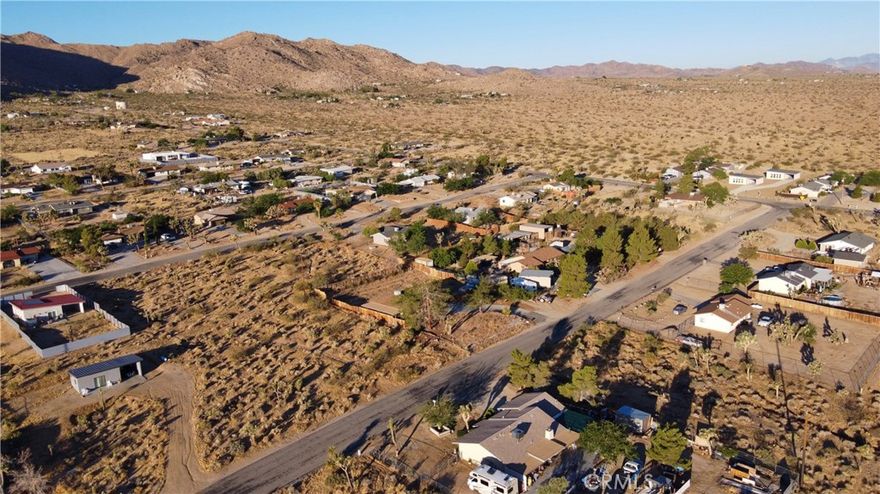 Nestled in the captivating landscape of Joshua Tree, this 18,198 square feet residential lot invites you to build your dreams and immerse yourself in the natural wonders of the area. Located just moments away from the awe-inspiring Joshua Tree National Park, this parcel of land offers the perfect canvas for your future oasis.
Imagine waking up to the stunning vistas of rugged desert landscapes and towering Joshua Trees, casting their enchanting shadows across your property. With ample space to create your own vision, you have the freedom to design a serene desert retreat that perfectly reflects your lifestyle.
Beyond the boundaries of your property, Joshua Tree offers a plethora of activities and experiences for nature enthusiasts and adventure seekers alike. Explore the iconic Joshua Tree National Park, where you can hike amidst otherworldly rock formations, discover hidden oases, and witness breathtaking sunsets that paint the desert sky with vibrant hues.
Indulge in stargazing at night, as Joshua Tree is renowned for its dark skies, making it an ideal destination for astronomy enthusiasts. The tranquil ambiance and lack of light pollution create a celestial spectacle that will leave you in awe of the vastness of the universe.
Immerse yourself in the local community and embrace the vibrant arts scene that thrives in Joshua Tree. Experience the eclectic art galleries, captivating music venues, and lively festivals that showcase the creativity and spirit of this unique desert town.
When you need a break from the desert's solitude, explore nearby attractions such as the Joshua Tree Music Festival, where you can revel in the rhythms of talented musicians from around the world. Take a short drive to the nearby town of Palm Springs for a day of shopping, dining, and rejuvenation at its luxurious spas.
Escape the hustle and bustle of city life and embrace the tranquility and natural beauty that Joshua Tree has to offer. This residential lot presents an incredible opportunity to create a harmonious connection with the desert landscape and become part of a community that cherishes its surroundings.
Seize the chance to build your dream home and immerse yourself in the unique experiences that Joshua Tree and its surroundings have to offer. Your desert oasis awaits.