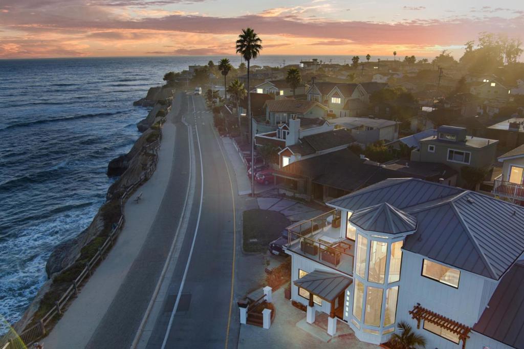 Life sometimes comes down to opportunities taken advantage of and those regretfully missed. One of less than 20 single family homes on this part of East Cliff Dr, this house sits in the premier location of the renowned surfing community known as Pleasure Point. The stunningly remodeled home features 4 bedrooms w/ 2 on the ground floor, 4 full bathrooms, and the best views on the street of world class waves from Sewer Peak to the Hook! Downstairs features an open kitchen/living room facing the Monterey Bay and is filled with life, activity, & lots of natural light. The 4th bedroom is tucked behind the garage and accessed from either the kitchen hallway or an exterior door making for the perfect guest suite for friends and family weekends! Parking is not an issue as there is room for 4-5 cars in the driveway as well as the 1 car, 240 EV charging plug ready garage. Walking amenities are a plenty with several restaurants, coffee shops, gymnasiums, & shopping all less than 10 minutes away.