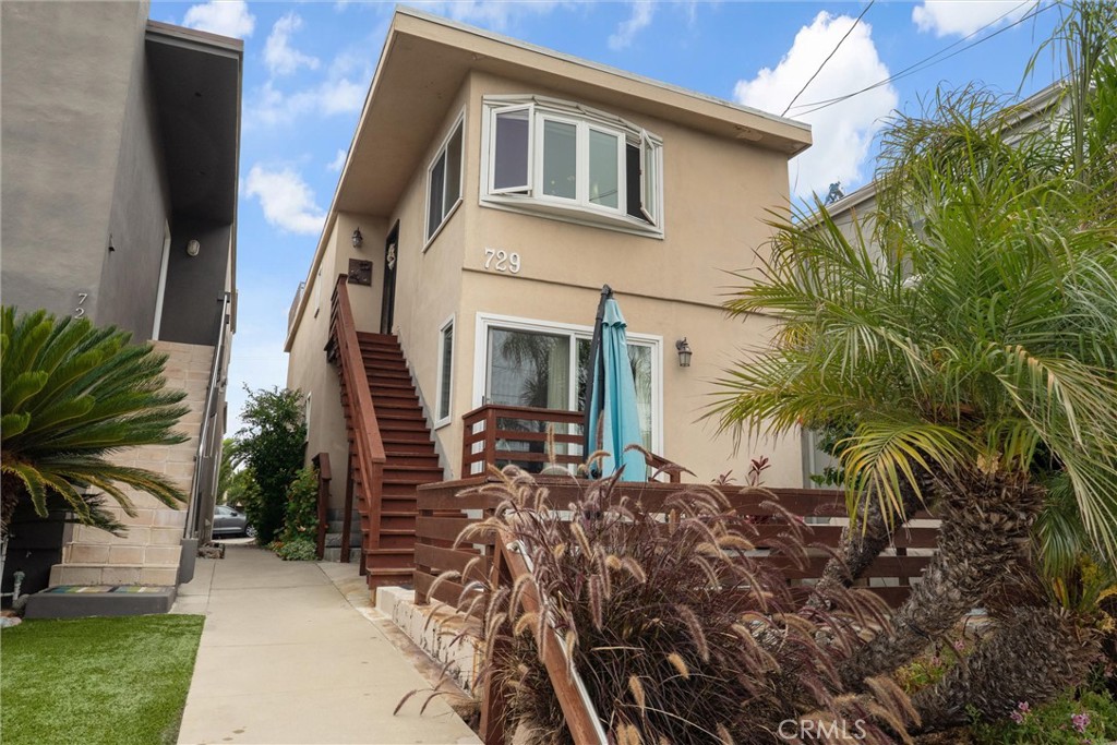 Fantastic income-producing duplex in Hermosa Beach’s prestigious Hill Section! this property offers two 2-bedroom, 2-bath units with separate entrances, providing exceptional flexibility for investors, owner-occupants, or multi-generational living. With a total of approx. 2000 sqft on a 2,505 sqft lot, both units deliver comfortable coastal living in one of the most sought-after neighborhoods. The lower unit features a large ocean-view walk-out patio perfect for entertaining or relaxing, along with hardwood floors, granite countertops, stainless steel appliances, updated finishes, and abundant natural light. The upper unit mirrors the 2-bed, 2-bath layout and includes access to a spacious rooftop deck offering 360-degree ocean views—ideal for enjoying stunning sunsets and coastal breezes. On-site parking and mature landscaping add convenience and curb appeal. Just six blocks to the sand and surf, and within walking distance of vibrant downtown Hermosa Beach and Manhattan Beach restaurants, parks, and shops. This rare duplex opportunity combines beach-town lifestyle, strong rental potential, and prime location. Don’t miss your chance to own an exceptional property in Hermosa Beach’s coveted Hill Section!