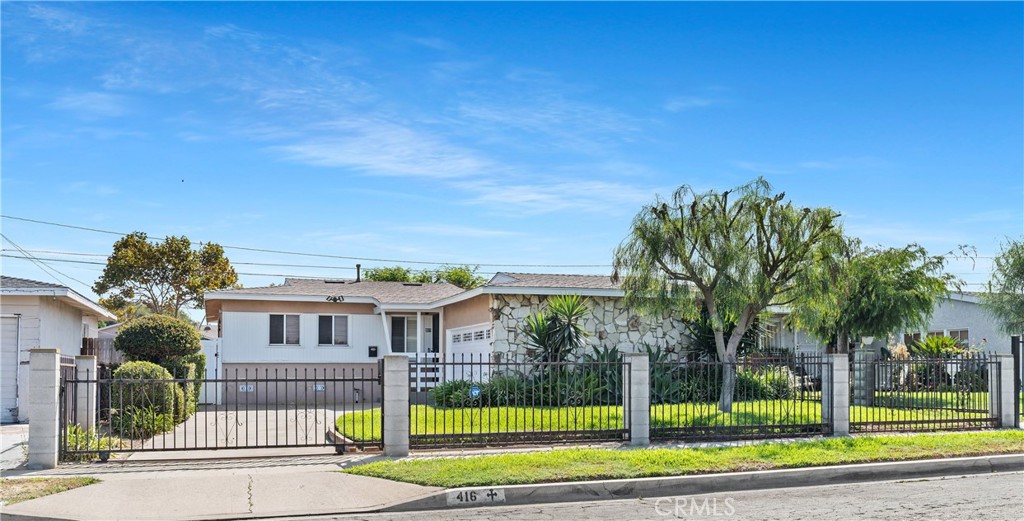 Lovely well maintained home with awesome curb appeal showcasing a clear sense of pride of ownership. This inviting residence features three bedrooms and two bathrooms, with newer floors that provide a fresh, modern feel. The beautiful updated floors complements the original charm of this home. Enjoy a spacious kitchen equipped with stainless steel appliances. The property includes a gated oversized driveway, two-car attached garage that offers convenience for storage, daily living and an in garage laundry area. The backyard is a very nice size that's ideal for entertaining or relaxing. This well-kept home combines modern updates with timeless appeal offering comfort, style and charm and is ready for its new owners to move in and make it their own.