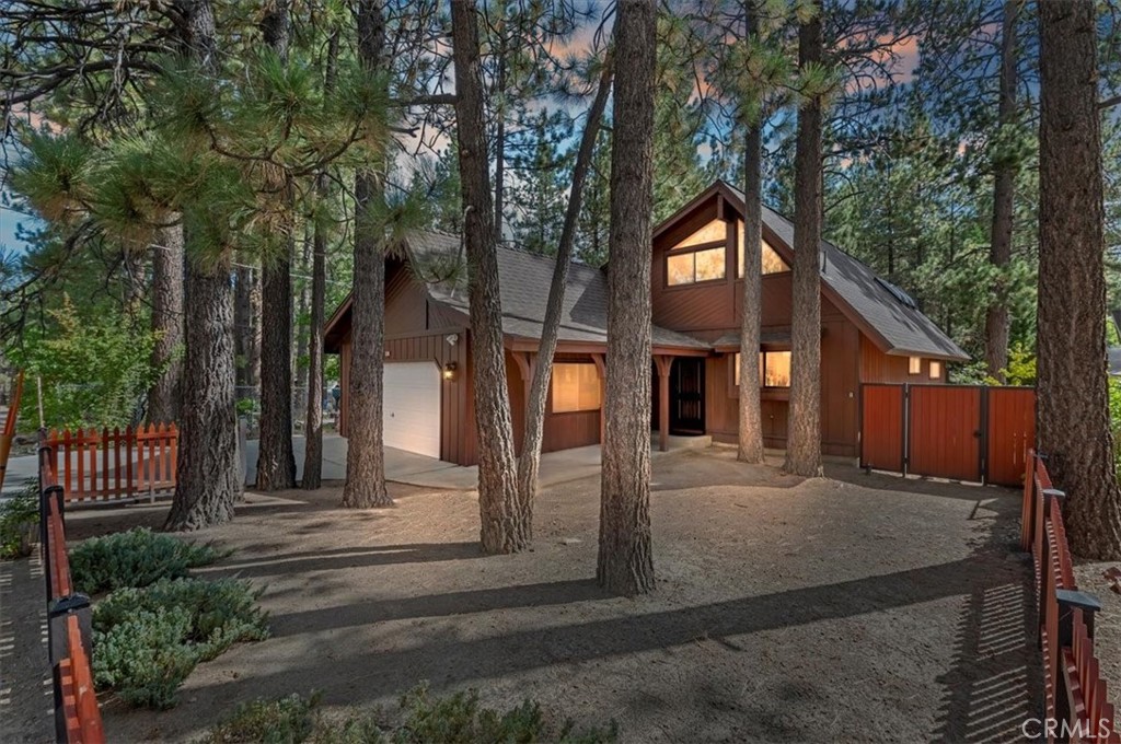 Gorgeous retreat in immaculate updated condition! Located minutes to Snow Summit, the village and lake is this very custom upgraded home filled with light and cozy ambience. Kitchen and bathrooms all boast new quartz countertops, and bathrooms are beautiful with custom showers, new Kohler toilets, counters, and fixtures. A spacious kitchen and dining room are open to the spectacular living room! Soaring cathedral ceilings in the living room are awesome with skylights and lux furniture to relax and enjoy! Speaking of furnishings, each room boasts high end furniture which is included per inventory list, and updated lighting. Downstairs is the master suite and additional large guest bedroom both with adjoining bathrooms, upstairs the 3rd bedroom is a fabulous loft including 3 beds which sleep 5 and it's own half bath! The garage is currently being used as an amazing game room including a fooz ball table, pool table, ping pong table, epoxy flooring, TV and electric fireplace. The backyard is also a dream for you and your guests. Featured are quality outdoor seating on the deck for relaxing, dining and enjoying nature. It is fully fenced with a quality KidsKraft play station, and 120 feet of outdoor party lights! Upgrades include an EV charger, smart TVs, tankless water heater, new 200AMP electrical panel, American Standard furnace, and even a smart wi-fi irrigation system! This home has been an extremely successful vacation rental with Destination Big Bear, so check first if you wish to view on the weekend. It's truly a gem-you will love it!