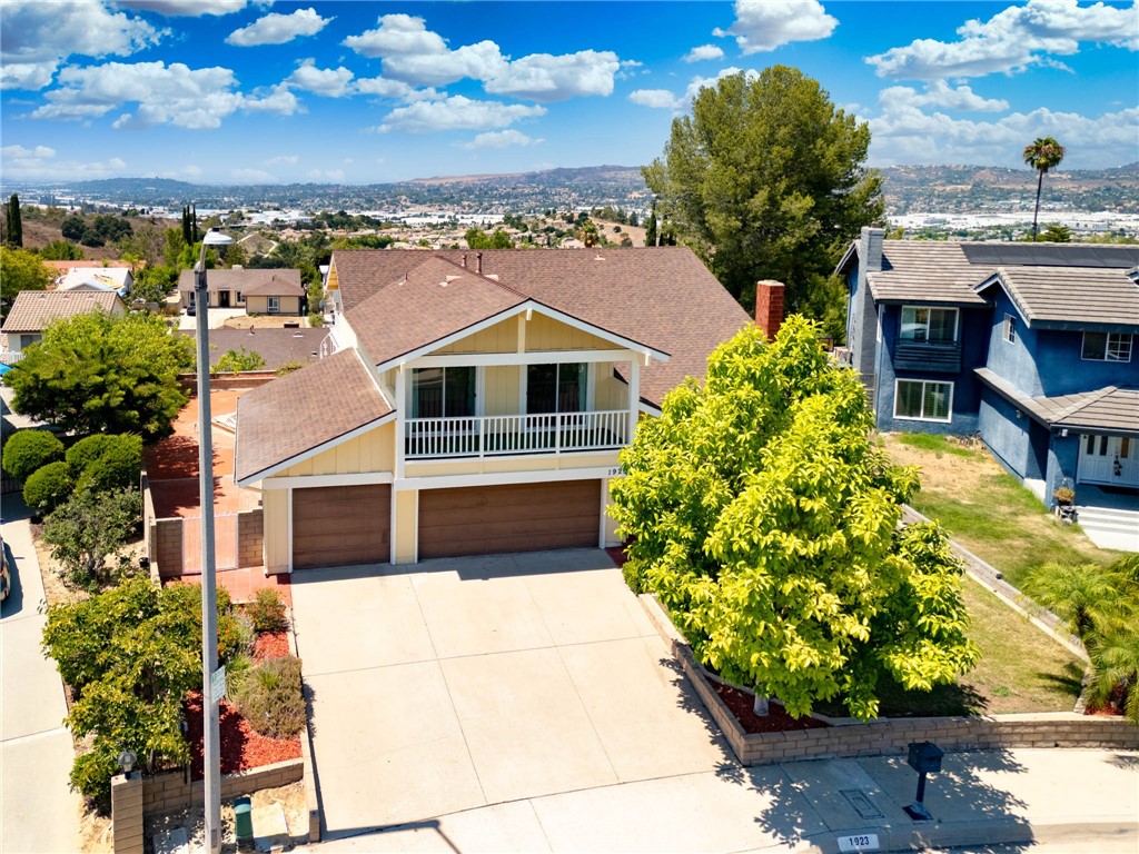 Beautiful 2-Story Home with Stunning and Breathtaking 180° Panoramic City Lights & Mountain Views in Diamond Bar walking distance to the award winning Diamond Bar High School. If you love mountainous and city light view, this home is exceptional and perfect for you. The view is stunning and breathtaking looking from the oversized refinished deck right off second floor loft! AND almost every room in the house you can enjoy this ever changing views in every corner at your own home. Located on a peaceful cul-de-sac, this well-maintained home offers 4 bedrooms and 3 bathrooms, including a convenient downstairs bedroom and bath, plus a spacious bonus room that can serve as a fifth bedroom. New flooring were just installed professionally and exterior paint also. The open floor plan features soaring vaulted ceilings as you step in the home, a large family room connected to the kitchen, and a living room with a cozy fireplace and wet bar. The kitchen includes cherry wood cabinets, granite countertops, and stainless steel appliances. Other features include wood shutters, dual-pane windows and sliding doors, and both front and backyards professionally landscaped with a covered patio and fruit trees. The primary suite offers a roomy bath with marble finishes, a soaking tub, and a separate shower. From the backyard, enjoy breathtaking 180° city lights and mountain views also boost of an In-Ground Jacuzzi or relaxation or entertaining.