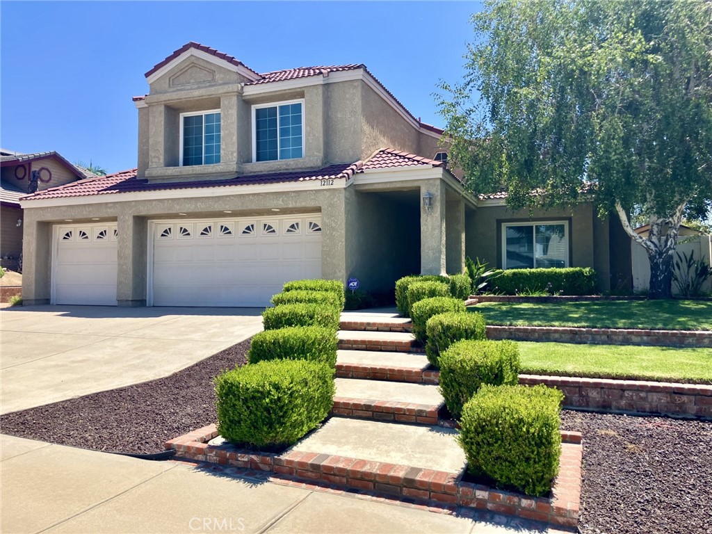 Prime location in Moreno Valley neighborhood! Spacious 4 bedroom/3 bathroom two-story home. Meticlously maintained front and backyard landscaping. Large covered patios in backyard offer room for entertaning and relaxing. Multiple access doors from family room and kitchen. Master bedroom features a balcony with peek a boo views of the local hills. Interior features grand staircase with built in outlets on the ledges for holiday decorating! Fireplace in living room. Downstairs guest bathroom. Kitchen features granite countertops, island, upgraded cabinets and more! Recessed lighting throughout. Master bathroom features built in vanity cabinets, soaking tub and walk in closet. Direct access 3 car garage with pull down stairs to access attic for additional storage. Garage also includes laundry room. Close to schools, shopping, parks and freeway access!