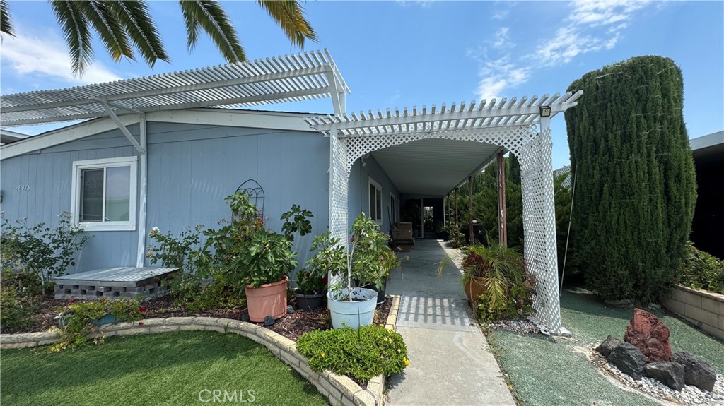 This beautiful manufactured house with its own land is located in the very sought after 55+ Golf Knolls community in downtown area of the resort city of Murrieta, blocks away from the wine country of Temecula. It is close to hot springs, restaurants, shops, banks and medical services. This home sits right next to the golf course, with vast view of the green that you can see from the living room. There are 2 good size bedrooms and an office. The living room is very spacious next to the open style kitchen. This house boasts of a very new roof which was completely torn down and installed 3 years ago. The floor, paint, kitchen, bathrooms, bedrooms and the office were all renovated 3 years ago, the water heater was replaced 2 years ago. The termite inspection has been done and the house will be termite-free for the new owners. So it is very move-in ready. This is a home that is to see and to love.