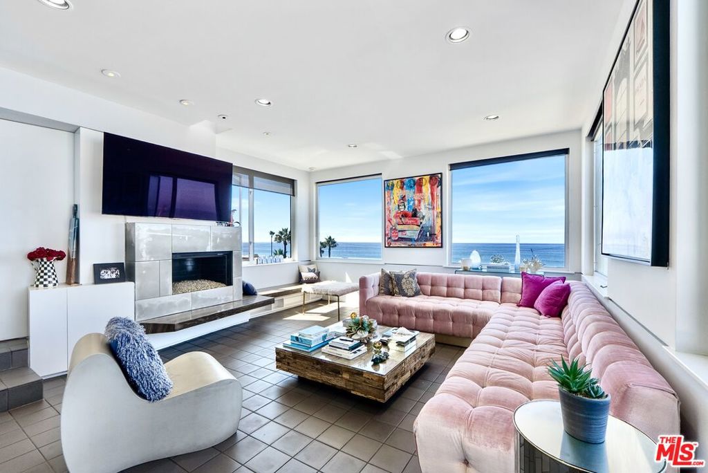 Welcome to The Hermosa - an architectural masterpiece designed by renowned architects Thom Mayne and Michael Rotondi, and featured in Architectural Digest. Live the California dream in this fully furnished multi-level home located at the north end of Hermosa Avenue on a no-through street directly across from the sand. The residence opens with a dramatic 30-foot entry ceiling and showcases panoramic ocean and coastline views from Malibu to Palos Verdes, including both the Manhattan Beach and Hermosa Beach piers. While title records reflect 2 bedrooms, the home has been designed and furnished as 4 bedrooms, with 2 full bathrooms and 2 half bathrooms. Each bedroom is situated on its own level and tucked away on a different side of the house, offering unmatched privacy and flexibility for families, guests, or even a co-living setup. A private in-home elevator provides easy access between levels, while a relaxing sauna adds a spa-like touch. The home also features two fireplaces: one in the living room and another in the primary suite for cozy nights by the ocean, and fully concealed ceiling speakers that blend in seamlessly, keeping the design sleek and minimal. Designed for effortless entertaining, enjoy multiple balconies, a Jacuzzi spa, built-in BBQ, pizza oven, fire-pit, outdoor speaker and TV perfect for Sunday football, outdoor movie nights, or watching your favorite games under the stars. Walking distance or a short bike ride to Downtown Hermosa and the Manhattan Beach Pier. Beach equipment, bikes, and even an electric bike are included to complete the Strand lifestyle, while security cameras provide added peace of mind. On rainy days, skip the bike ride and enjoy a Peloton workout while binge-watching your favorite show.