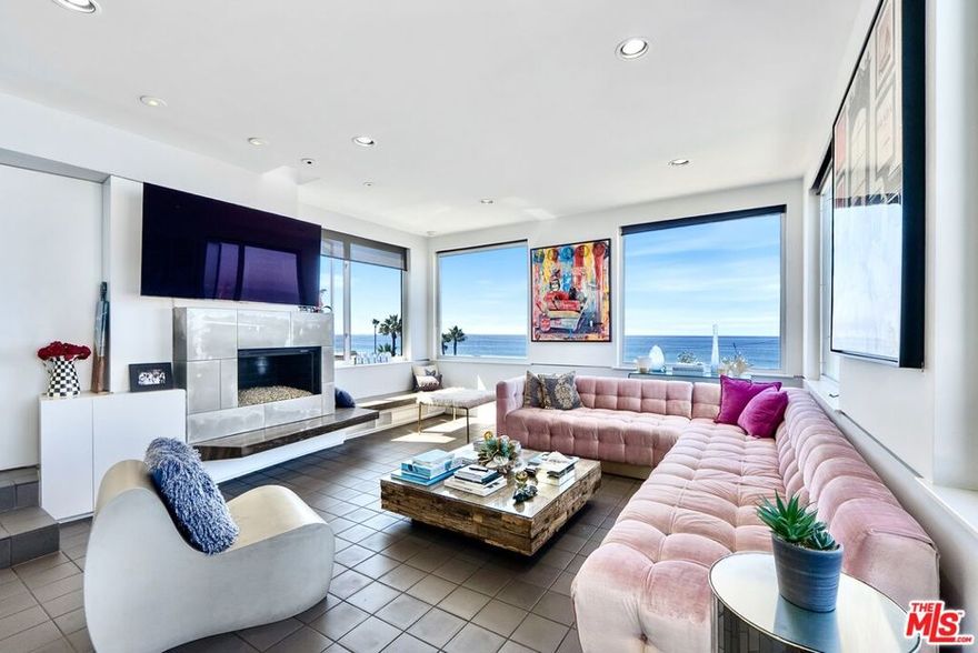 Welcome to The Hermosa - an architectural masterpiece designed by renowned architects Thom Mayne and Michael Rotondi, and featured in Architectural Digest. Live the California dream in this fully furnished multi-level home located at the north end of Hermosa Avenue on a no-through street directly across from the sand. The residence opens with a dramatic 30-foot entry ceiling and showcases panoramic ocean and coastline views from Malibu to Palos Verdes, including both the Manhattan Beach and Hermosa Beach piers. While title records reflect 2 bedrooms, the home has been designed and furnished as 4 bedrooms, with 2 full bathrooms and 2 half bathrooms. Each bedroom is situated on its own level and tucked away on a different side of the house, offering unmatched privacy and flexibility for families, guests, or even a co-living setup. A private in-home elevator provides easy access between levels, while a relaxing sauna adds a spa-like touch. The home also features two fireplaces: one in the living room and another in the primary suite for cozy nights by the ocean, and fully concealed ceiling speakers that blend in seamlessly, keeping the design sleek and minimal. Designed for effortless entertaining, enjoy multiple balconies, a Jacuzzi spa, built-in BBQ, pizza oven, fire-pit, outdoor speaker and TV perfect for Sunday football, outdoor movie nights, or watching your favorite games under the stars. Walking distance or a short bike ride to Downtown Hermosa and the Manhattan Beach Pier. Beach equipment, bikes, and even an electric bike are included to complete the Strand lifestyle, while security cameras provide added peace of mind. On rainy days, skip the bike ride and enjoy a Peloton workout while binge-watching your favorite show.