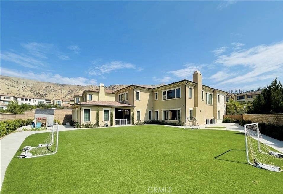Stunning corner lot residence in the highly desired 24-hour guard-gated Orchard Hills master-planned community! This home comes with five ensuite bedrooms, a large kitchen and a secondary high heat kitchen! The main floor bedroom is in the detached casita with a walk in closet and private bathroom. The huge backyard allows for a lot of room to entertain. This property is located within the boundaries of the highly acclaimed Beckman High School and conveniently located near many restaurants and shops.