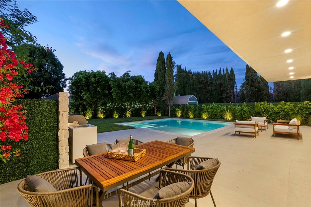 Experience Luxury Living in This Brand-New, Resort-Style Masterpiece
Welcome to this stunning single-story modern home, where impeccable design meets everyday comfort. Situated on one of the largest lots in the area—just under 8,000 sq ft—this 4-bedroom, 3-bathroom residence offers resort-style living with 10-foot ceilings and sophisticated finishes throughout.
From the moment you arrive, the curb appeal is undeniable: the front exterior showcases White Tuscany natural stone, a striking black glass entry door, and a custom wood-paneled garage—creating a bold yet elegant first impression.
Step inside this smart home and be captivated by its clean lines, contemporary aesthetic, and seamless layout. The chef’s kitchen features top-of-the-line appliances, custom cabinetry, and an oversized island that flows into the open living space. Massive double-panel sliding doors invite you outside to your private backyard oasis.
Enjoy California living at its finest with an expansive pool, oversized Baja shelf, zero-edge jacuzzi, and large-format designer tile that blends indoor and outdoor elegance. The backyard is perfectly designed for entertaining, complete with a built-in BBQ, a spacious grassy area, and plenty of room to relax and play.
All bedrooms are generously sized, while the primary suite is a true retreat. The spa-inspired primary bathroom features a large walk-in shower, premium finishes, and a smart electric toilet for a touch of daily luxury.
Located minutes from top-rated schools, shops, dining, parks, and easy freeway access, this home is not just a place to live—it’s a lifestyle.