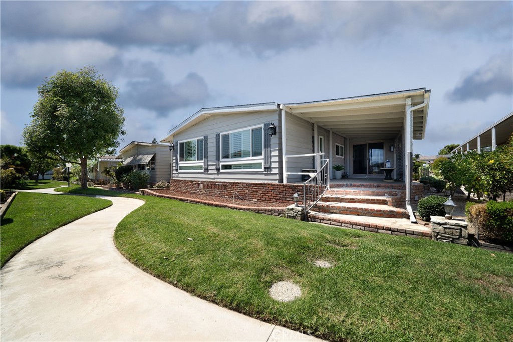 Presented is the exquisitely remodeled two bedrooms and two bathroom residence over 1700 SQF with its own side by side covered carport in the exquisite community of Lake Park in La Habra. The house seamlessly blending elegance and comfort. Once you enter the house, the spacious living room is embraced with natural light, bright and inviting. The entire house is with stylish laminate flooring and light-filled living areas with plantation shutters on the dual pain windows. The gourmet kitchen open to the family room is the main focal points of the house. The sleek white cabinets, white quartz countertops with tile backsplash, stainless appliances, big stainless sink and the natural light pouring through the skylight makes the cooking joyfull. The big family room is perfect for gatherings with family and friends for dinner and fun games. The primary en-suite makes you the master of the house, with walk-in closet and mirrored closet with built in organizers and small retreat can be used as an office or work room. The highlight of the ensuite is the spacious bathroom with modern style walk-in shower, and quartz countertop. The second bedroom offers a good size closet space and is connected to a bathroom with walk-in shower. Perfect for guests or bonus room. There is washer and dryer is net to the bathroom with some cabinets and it leads to the back side of the house with big shed for abundant storage space with built-in shelves and electricity. Next to the shed is the side-by side two car covered carport, available for electric car charger. Enjoy indoor-outdoor living with a private patio and beautifully landscaped surroundings. Once step in to the front covered porch, you can relax with a cup of coffee and enjoy the cool breeze.
The residence offers a recently changed HVAC system, roof, water, entire home repiping, canned lighting, ceiling fans in each rooms and much more. It is just a few steps away from the clubhouse, lake, community pool, billiards and lots of events for everyone in the community. Great place to meet great neighbors and friends. The Lake Park La Habra is conveniently located near schools, shopping, golf course and hospitals and more.