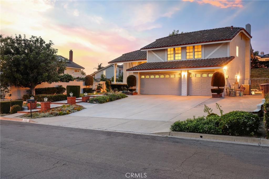Welcome to this exceptional home nestled in one of Yorba Linda’s most sought-after neighborhoods. Situated on an expansive 10,000+ sq. ft. lot on a quiet cul-de-sac, this beautifully appointed residence offers approximately 2,700 sq. ft. of elegant living space, including 4 spacious bedrooms and a large bonus room with a closet—ideal as a fifth bedroom, media room, or game room. Enter through the grand double-door entry into an open-concept floor plan designed for both everyday living and sophisticated entertaining. The formal living and dining rooms exude timeless charm, while the inviting family room features a cozy fireplace—perfect for relaxed gatherings. Ceramic tile flooring flows throughout the main living areas, adding both style and durability. The open kitchen, remodeled in the last 8 years, is a chef’s delight, featuring a bright sunlit breakfast nook, ample cabinetry, and a charming garden window that brings the outdoors in. A built-in mini bar with sink adds a touch of luxury and convenience for entertaining. Outdoors, enjoy the privacy and tranquility of a generously sized backyard complete with two covered patios, mature fruit trees, and blooming rose bushes. With possible RV access or side parking, this home combines flexibility and function. The attractive tile roof adds lasting curb appeal. Additional amazing features include new exterior and interior paint throughout, an AC unit and ducting that is less than 3 years old, and windows that have been replaced in the last 8 years. With NO HOA and NO Mello Roos, this is an incredible opportunity to own a meticulously maintained home in a prestigious and peaceful community. Don’t miss your chance to experience the best of Yorba Linda living!