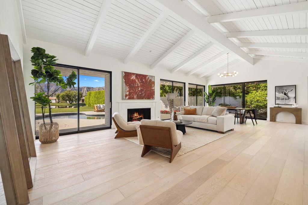 HUGE PRICE REDUCTION. Priced to sell! Welcome to 11 Sussex Court, a breathtaking residence located within the exclusive, guard-gated community of Morningside in Rancho Mirage. Offering 3,034 sq ft of refined living on an 8,276 sq ft lot, this home blends timeless elegance with modern upgrades and panoramic 360 views, including a tranquil lake view from the backyard and a serene association waterfall just steps away.Inside, soaring 14-foot ceilings and oversized double-pane windows fill the home with natural light, creating a bright, airy ambiance. The expansive living area features a cozy gas fireplace, while the chef's kitchen impresses with porcelain countertops, soft-close cabinetry, and a spacious layout ideal for entertaining. Dine casually in the breakfast nook or host guests in the formal dining space.Engineered wood floors flow throughout the home, adding warmth and sophistication. There are three spacious bedrooms, two with en-suite bathrooms, and one with private courtyard access, perfect for guests or a home office. A stylish powder room provides added convenience.Step outside to a private oasis with a newly reconstructed Pebble Tec pool, reimagined pool deck, and lush citrus trees, all set against stunning mountain and lake views. A two-car garage with golf cart parking completes the package.As part of the Morningside community, residents enjoy world-class amenities including: Seven community pools On-site dog park 24-hour guard-gated security with CPR/AED-certified staff Bulk Spectrum cable and ultra-fast internetMorningside spans 165 acres of lushly landscaped grounds with over 10,000 seasonal flowers planted annually. With a golf membership, have access to an 18-hole Jack Nicklaus Signature Golf Course, with state-of-the-art fitness center, five hard tennis courts, one clay court, and a vibrant social calendar.Experience elegance, privacy, and unmatched desert living- schedule your private tour today!