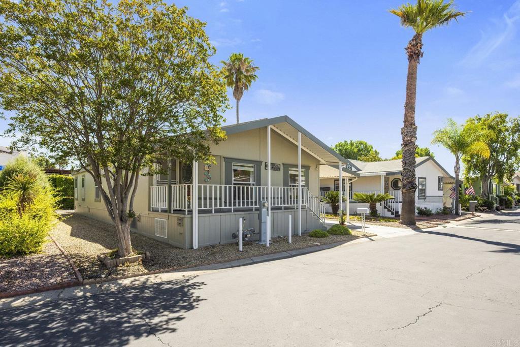 Welcome home to 525 W El Norte Parkway #301 in the highly desirable active 55+ community of Rancho Escondido. This immaculate Skyline Oak Manor manufactured home spans 1,493 square feet of living space with three spacious bedrooms and two well-appointed bathrooms while on a permanent foundation. Step inside to discover an open, airy layout that promotes a seamless flow throughout the home. Large windows invite ample natural light into the space, creating a bright and cheerful atmosphere. The oversize kitchen provides an abundance of counter and cabinet space offering plenty of room to make your favorite meal. The property has covered carport parking with two storage sheds and additional space in the rear of the property to add your own personal garden. The residence is nestled in a quiet corner of the community delivering additional privacy and tranquility while still being close to all the amenities that the park has to offer. Rancho Escondido features low HOA fees providing water, sewer, trash, basic cable plus pool, hot tub, community room and so much more. Close to grocery stores, pharmacy, shopping, dining, freeways and everything that North County has to offer. 525 W El Norte Parkway #301 is not to be missed!