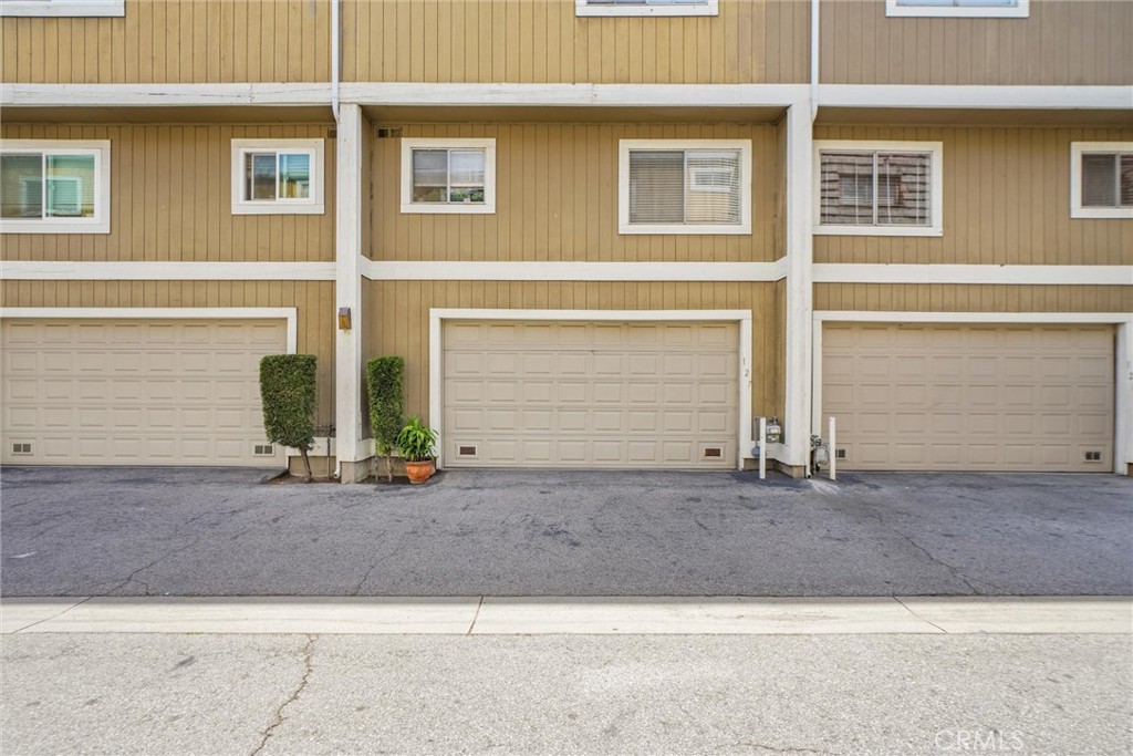 Motivated seller! Welcome to this well cared for unit. A 2 bedrooms and a bonus room by garage. 3 baths. All rooms are larger than normal. Immaculately clean home with updated kitchen and flooring. New air conditioner & heat furnace. Come and fill the cooziness of this lovely home. Community is under transformation and looks like this building is one of the next ones. You don't want to miss this unit with attached large 2 car garage and it's own laundry room. The HOA includes water and insurance. Don’t wait. Come see this great unit.