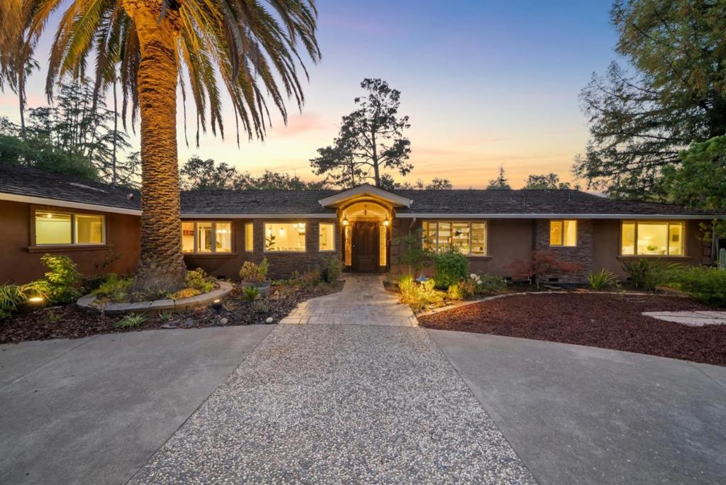 Welcome to 19521 Tweed Court, a beautifully updated single-story home located on a quiet cul-de-sac in one of Saratogas most sought-after neighborhoods. This Golden Triangle gem offers 4 bedrooms and 3 full bathrooms, with expansive living areas ideal for both comfort and entertaining. This property offers a flat lot with ADA compliant access. The freshly painted interior enhances the bright and airy ambiance. The spacious living room features a large sliding door that opens to the patio, creating a seamless indoor-outdoor experience. The thoughtfully designed kitchen is well-appointed with stainless steel appliances, custom cabinets and unique granite counter tops. A large island perfect for entertaining includes a food-prep space, a small sink and warming drawer. The expansive great room includes five large sliding doors and a skylight, providing abundant natural light and direct access to the patio and gorgeous pool. Conveniently located with easy access to Highway 85 and Lawrence Expressway, this home is just minutes from Saratoga Library, Westgate Mall and El Paseo Center, as well as downtown Saratoga offering a wide array of shopping, dining, and entertainment options. Enjoy access to award-winning Saratoga schools.
