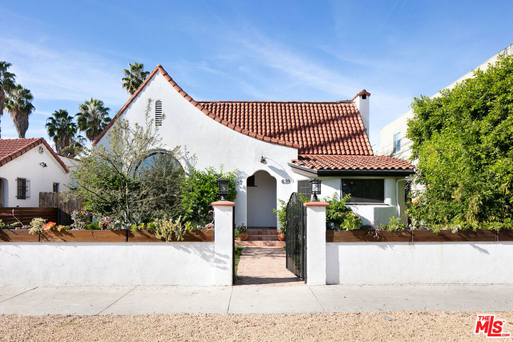 Beautiful 2 bedroom, 2 bathroom unit with a detached studio in a fully remodeled Spanish duplex. Highly coveted location in the heart of the Fairfax district. This unit has been meticulously renovated and offers high-end, modern upgrades including hardwood floors throughout, custom cabinetry, stainless steel appliances, central heat/AC, security system, and W/D in unit. The detached casita has a kitchenette, bathroom, heat/AC - perfect as a home office, exercise room or creative studio. Gated off-street parking. Walking distance to restaurants, shopping, and entertainment on Melrose.
