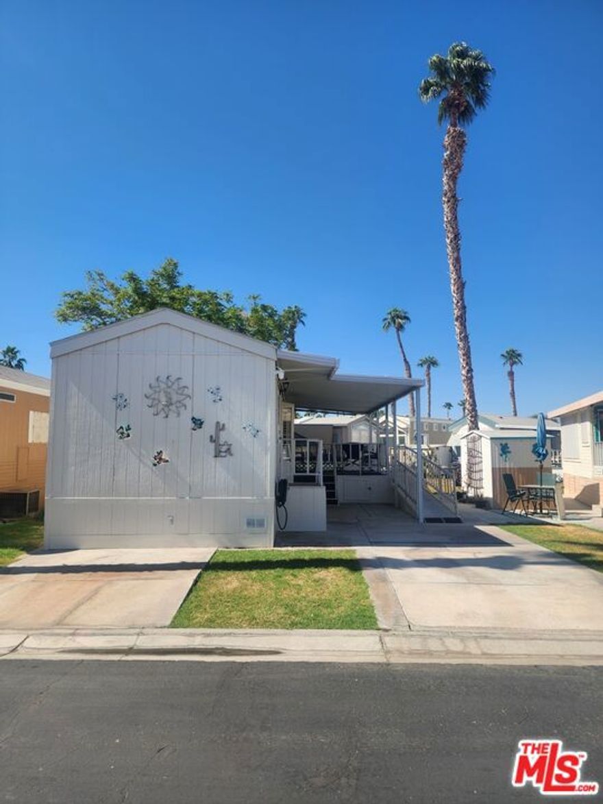 This Fleetwood model is Very clean, remodeled unit with new flooring and paint. Open concept with a porch overlooking the quiet greenbelt and community gazebo. Large parking area for truck and parking in front for golf cart. This all located in a 55+ community that has a 3 par golf course, chipping green, putting green, 9 hole mini golf, pickleball and tennis courts, bocce ball, an indoor shuffleboard courts, 2 clubhouses with pools and jacuzzies and an additional 4 satellites with pool, jacuzzies and mail boxes. This is all within a 24 hour gate guarded community of 801 lots, that consist of a combination of Park Models and RV lots, where you own the land. The resort has a limit of 270 day occupancy. It is a perfect place to spend your holidays in the sunshine.