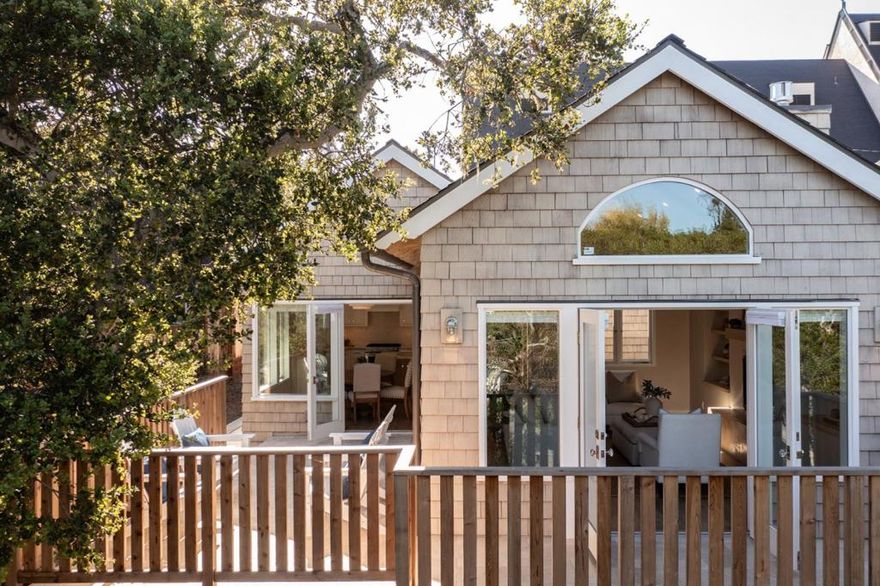 Nestled in the heart of downtown Carmel-by-the-Sea, this newly constructed, exquisite 4-bed, 3.5-bath luxury cottage is a rare blend of Carmel charm and refined craftsmanship. Designed by renowned architect Claudio Ortiz, every detail speaks to timeless elegance and California coastal living. Through the arched front door you are welcomed into a warm and inviting stained redwood accented home with a vaulted-ceiling living room adorned with custom shelving, gas fireplace, and radiant hydronic heat beneath engineered wood floors. The gourmet kitchen features a quartzite Taj Mahal island, skylights, and seamless flow to an Italian travertine deck, perfect for indoor-outdoor entertaining. Large windows with custom UK-imported hardware flood the home with southeast light. The main-level primary suite has a spa-like bath with a walk-in shower, underlit honey onyx counters, and a walk-in closet. Downstairs offers 3 bedrooms, a laundry room, family room, and 2 guest baths. Thoughtful details include a fresh air system, solar efficiency, tankless water heater, grade level 5 hand-troweled walls, and Montebella onyx bath counters in the guest bathrooms. With restaurants, shops, and beaches within walking distance, this is the perfect place to unwind after exploring​​‌​​​​‌​​‌‌​​‌​​​‌‌​​​‌​​‌‌​​​‌​‌​​​‌‌​ Carmel.