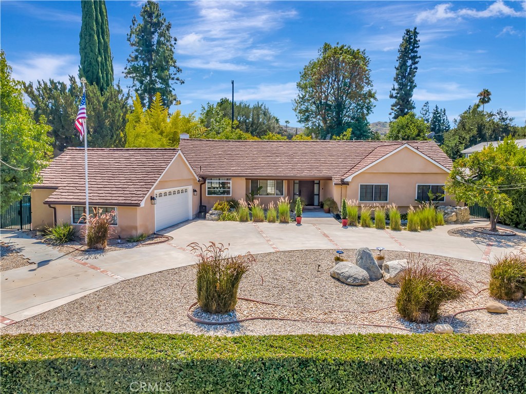 Beautiful Gated South of the Blvd. Woodland Hills Estate
Located in the exclusive and highly sought-after “Vista De Oro” neighborhood, this stunning estate offers exceptional privacy and luxury. Set on a large, flat lot, the home is surrounded by lush landscaping and features a grand circular driveway with ample parking, ensuring ease and convenience for guests.
The spacious, open floor plan creates an inviting atmosphere, seamlessly connecting the living, dining, and kitchen areas. The massive gourmet kitchen is a true chef’s delight, outfitted with high-end Viking and Sub Zero appliances, custom cabinetry, and a large center island—perfect for preparing meals and hosting family and friends.
The entire house has beautiful wood Japanese shutters / Sohji screens, which let in beautiful filtered light yet still provides privacy.
Step outside to your private oasis, where a sparkling pool, relaxing jacuzzi, and tranquil koi pond create the ultimate retreat. The back yard includes a built-in BBQ with a sink. The expansive entertaining areas, both inside and out, are ideal for hosting gatherings or simply enjoying peaceful moments in nature. Fruit trees add a special touch to this serene environment.
Modern amenities include a solar system, tankless water heater, dual air conditioning units, and energy-efficient features to ensure year-round comfort.
The private primary suite offers a serene escape, featuring a spacious layout and an expansive walk-in closet. A fourth bedroom was converted to an office that opens into the primary suite. This home is designed for effortless entertaining and luxurious living at every turn.
With its perfect combination of privacy, luxury, and function, this property is truly a one-of-a-kind gem in Woodland Hills. You will be impressed with the quality and condition of this home, schedule your private showing today!