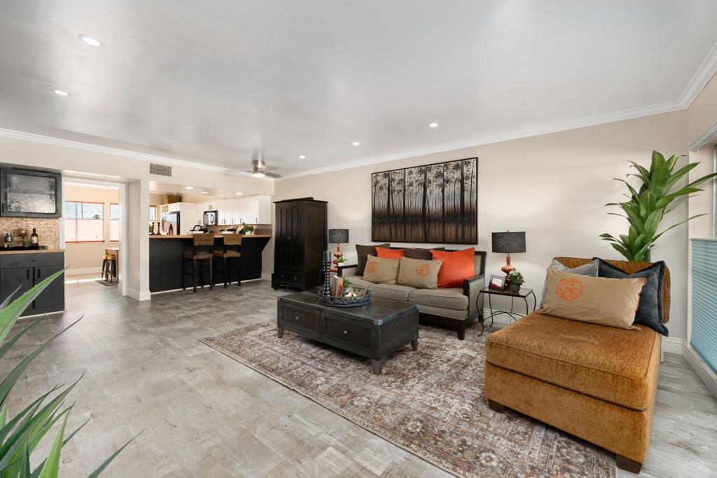 Seller Paid Full 2025 Building Assessment of $22,990 & Reduced Price nearly $30,000_ Welcome to Villa Alejo, an iconic mid-century gem designed by architect Donald Engen, located in the heart of downtown Palm Springs. Once a glamorous hotel that hosted Hollywood's elite in the 1960s, this beautifully updated 2 bedroom, 2 bathroom first-floor unit combines historic charm with modern convenience. Just seconds from downtown's top restaurants, boutique shopping, coffee shops, the casino, and the renowned Palm Springs Street Fair, this home offers an unbeatable location. Inside, the space has been thoughtfully upgraded with a modern kitchen featuring granite countertops with full backsplash and plenty of pantry storage, recessed lighting, crown molding, a dry bar with mini beverage fridge, and a stylish wood accent wall with electric fireplace and mounted tv in the living room. Luxury vinyl plank wood and tile flooring enhance the home's elegance, while a stackable washer/dryer and remodeled bathrooms add convenience. A stunning San Jacinto Mountain view from the kitchen and primary bedroom windows create the perfect scenic backdrop. Beyond the iconic staggered pipe brise-soleil (breeze block) breezeways that define Villa Alejo's distinctive architecture, this sought-after and stylish condo community offers resort-style amenities, including a heated in-ground pool and spa, a private gym and sauna, a community barbecue area, and a welcoming mid-century modern lobby with many of the original details. Additional perks include one assigned underground parking space, an extra storage unit, and guest parking. The HOA covers all ELECTRICITY (including A/C and heating!), WATER, TRASH, SEWER, PARKING, EARTHQUAKE INSURANCE, and ALL GROUNDS MAINTENANCE, making this an incredible value. With its prime location just steps from Palm Canyon Drive's lively attractions, world-class entertainment, and endless outdoor recreation, this move-in-ready home is a rare opportunity to experience the best of Palm Springs living.